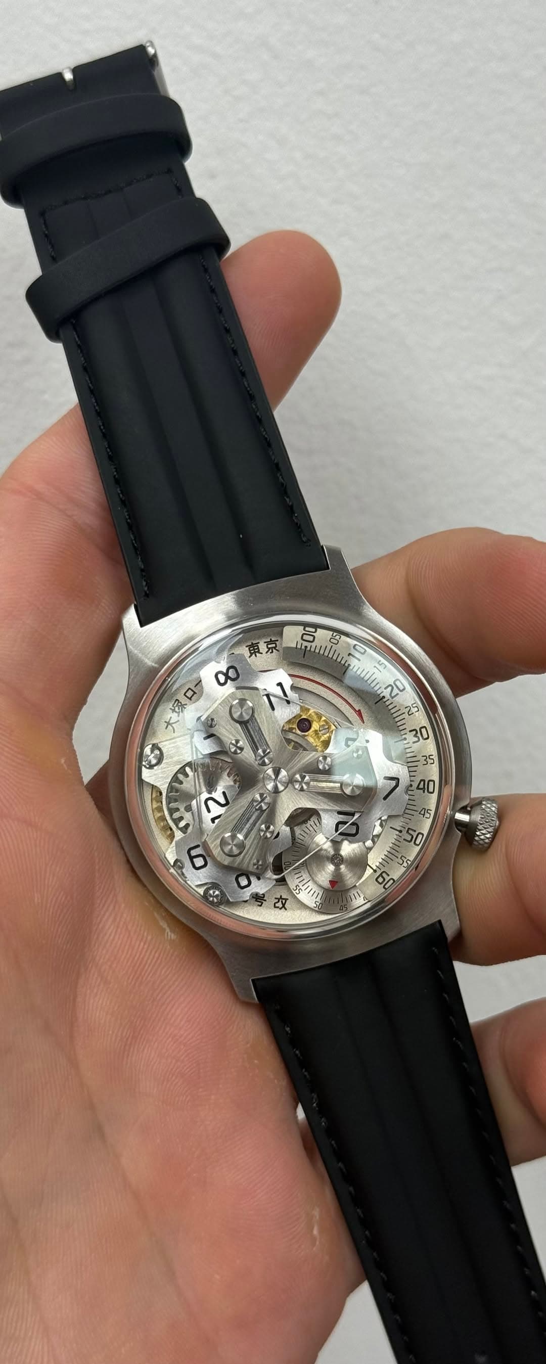 May be an image of wrist watch and text