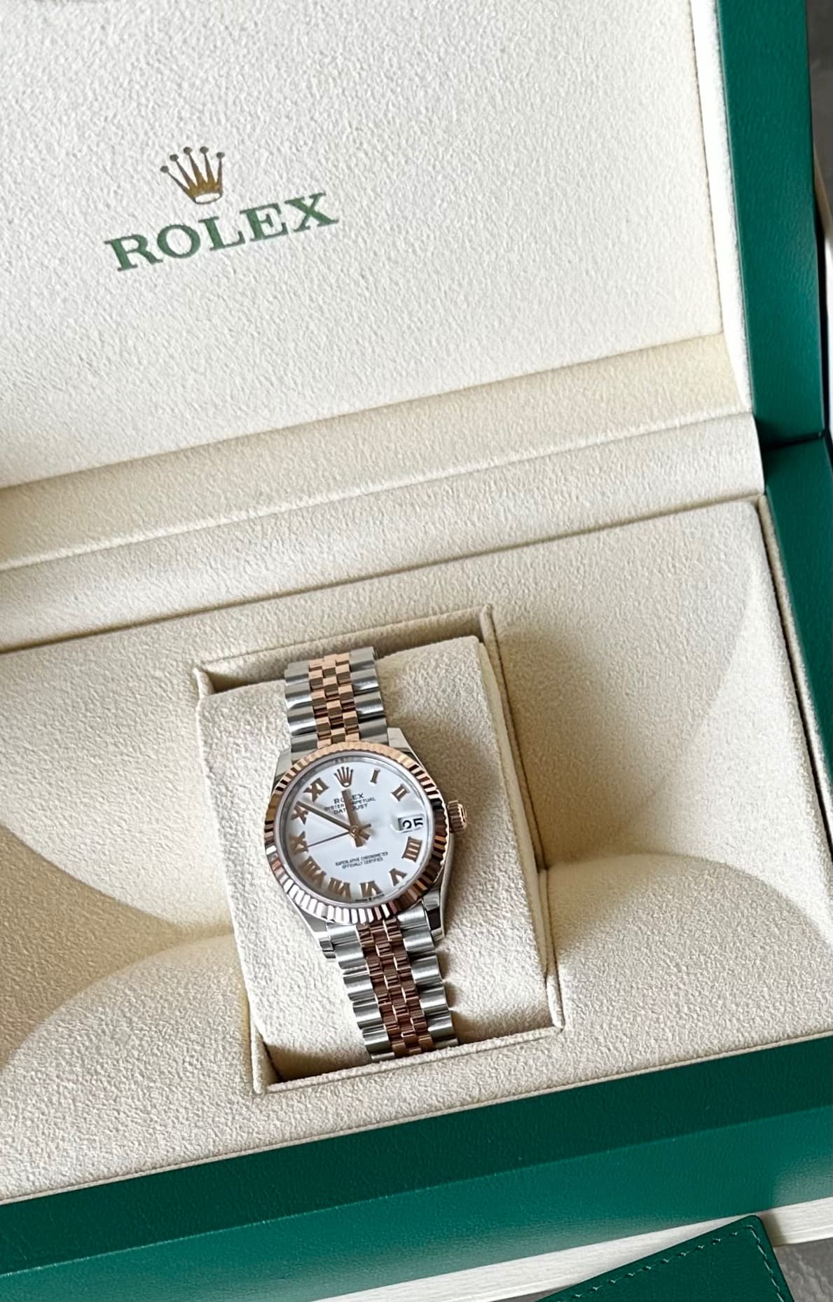 May be an image of wrist watch and text