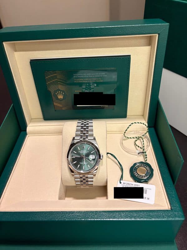May be an image of wrist watch and text