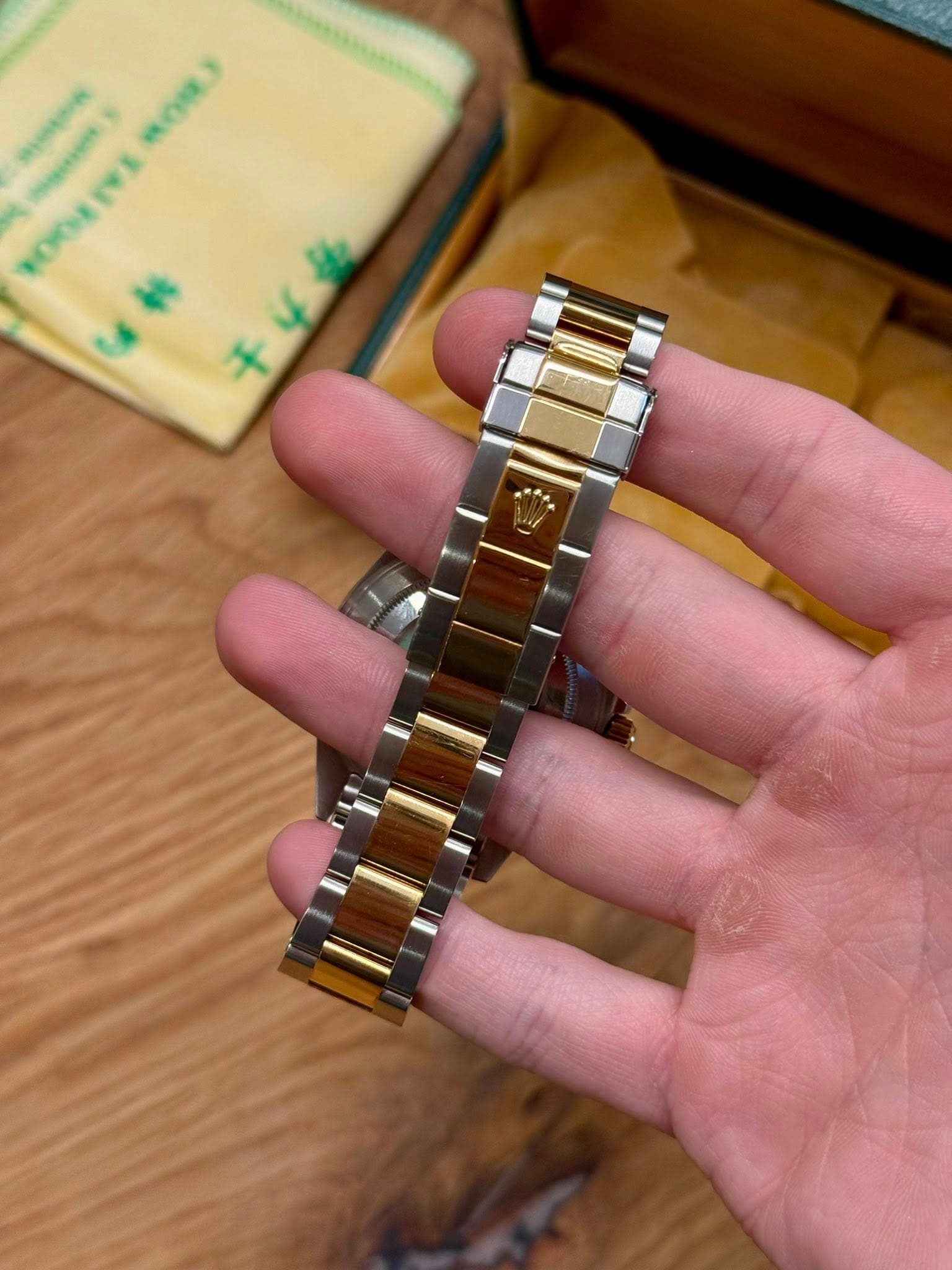 May be an image of wrist watch and text