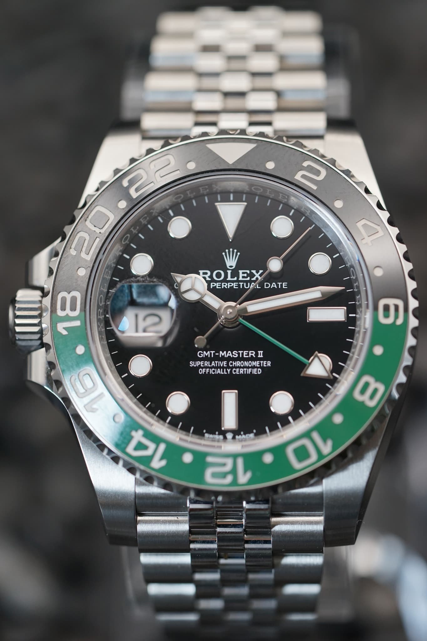 May be an image of wrist watch and text that says ' ROLEX PERPETUAL PERPETUALDATE PERPE TUPL DATE 12 6 GMT- GMT-MASTERII n SUPERLATIVE SUPERLATIVECHRONOMETER HRONOMETER…