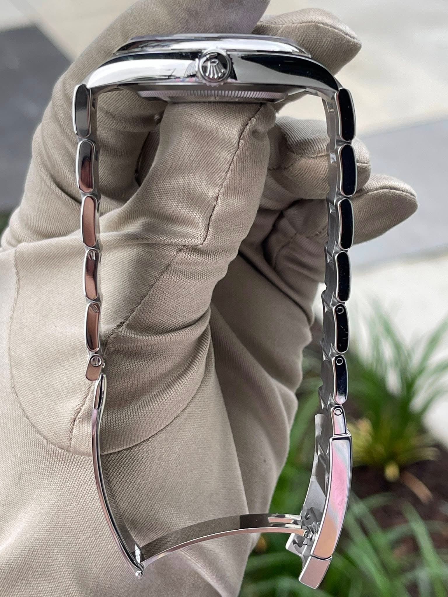 May be an image of wrist watch and jewelry
