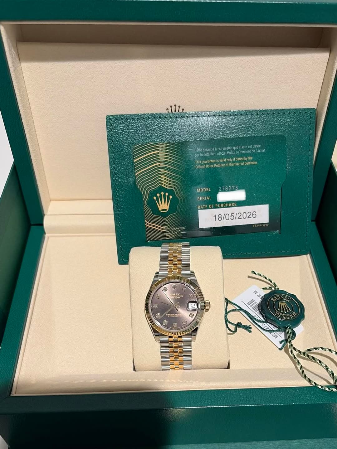 May be an image of wrist watch and text