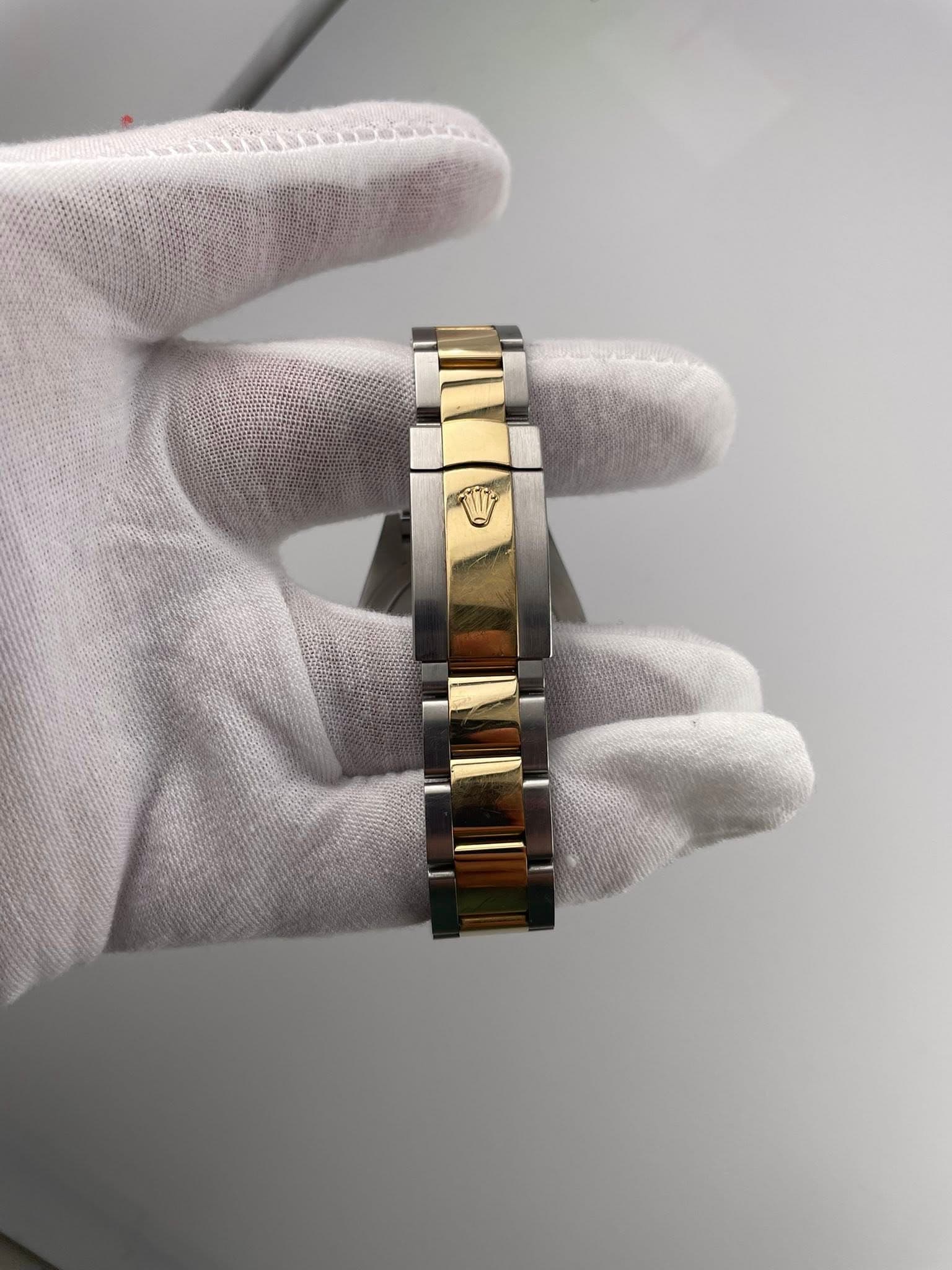 May be an image of jewelry and wrist watch
