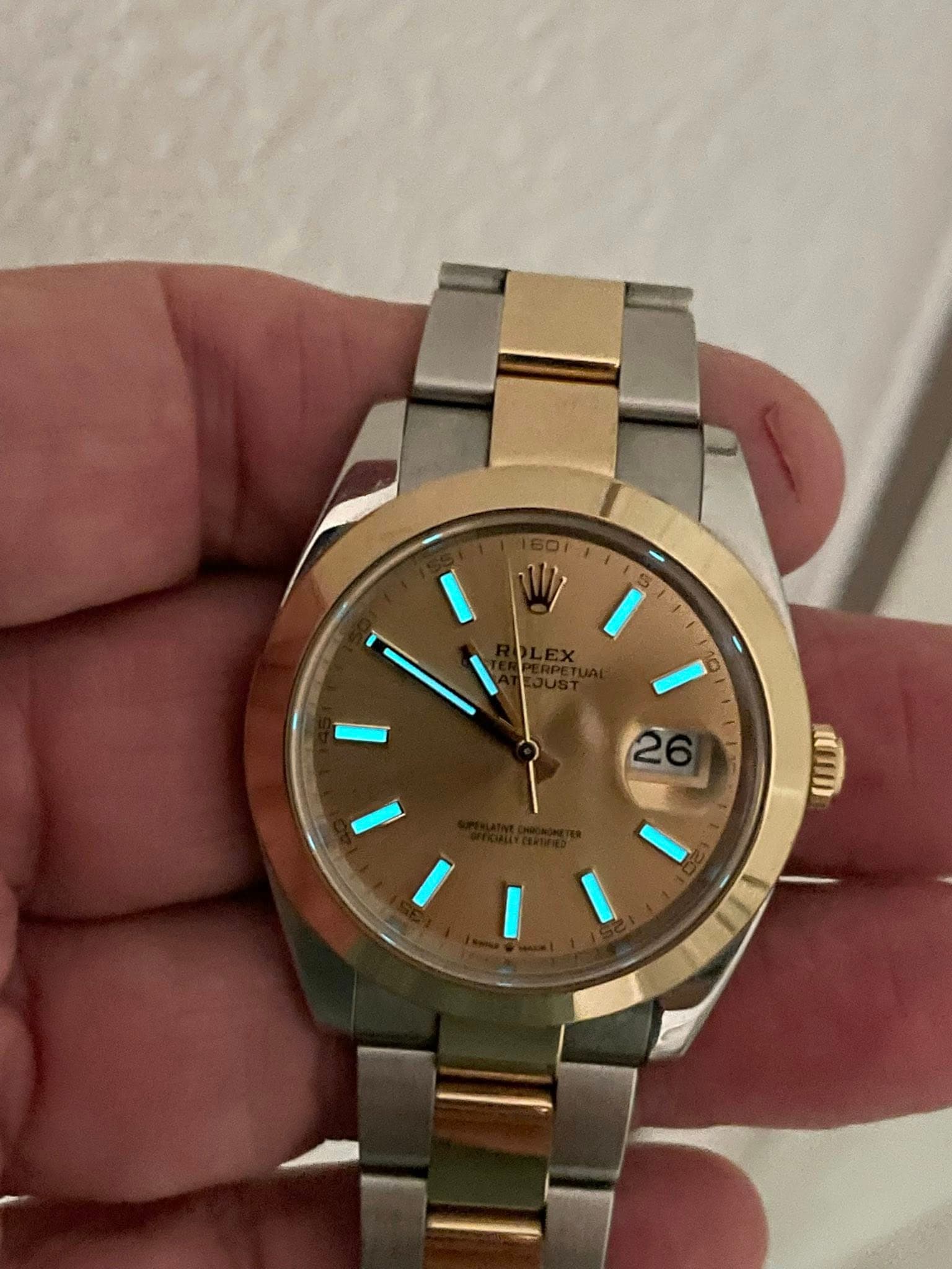 May be an image of wrist watch and text