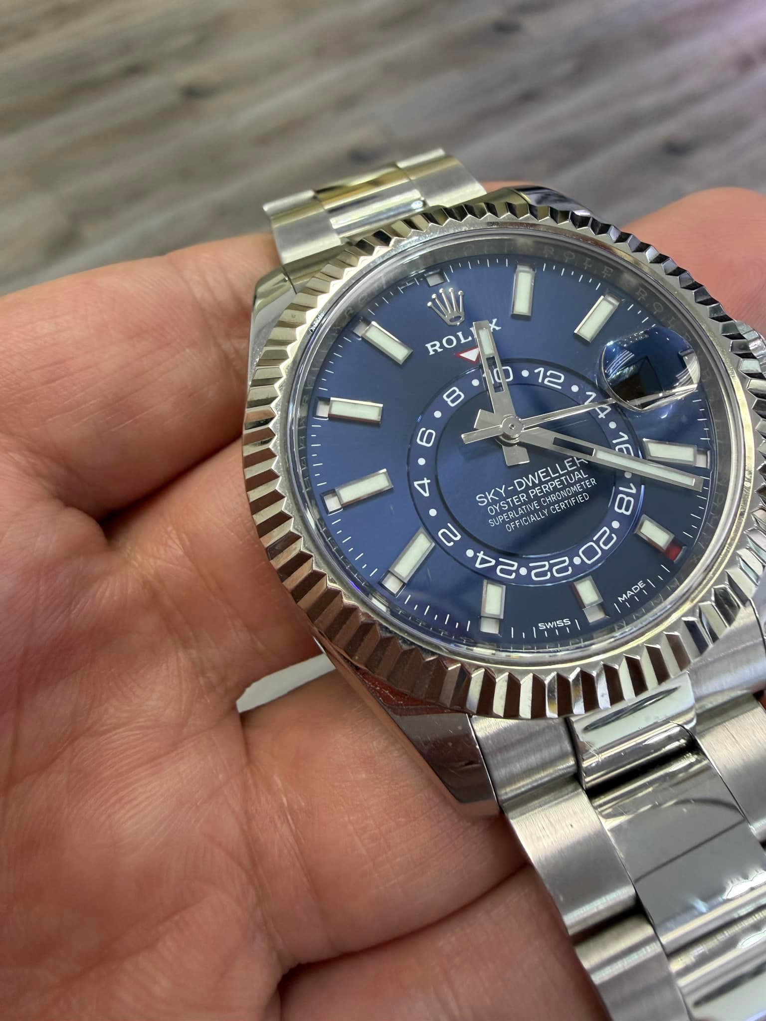 May be an image of wrist watch and text