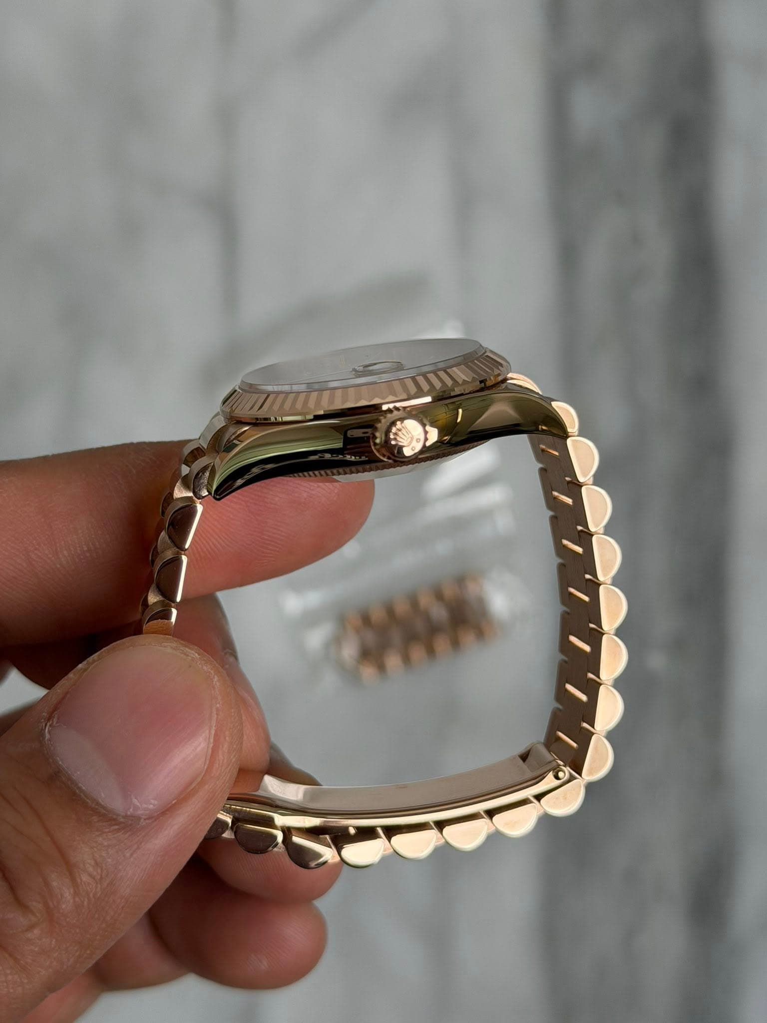 May be an image of jewelry and wrist watch