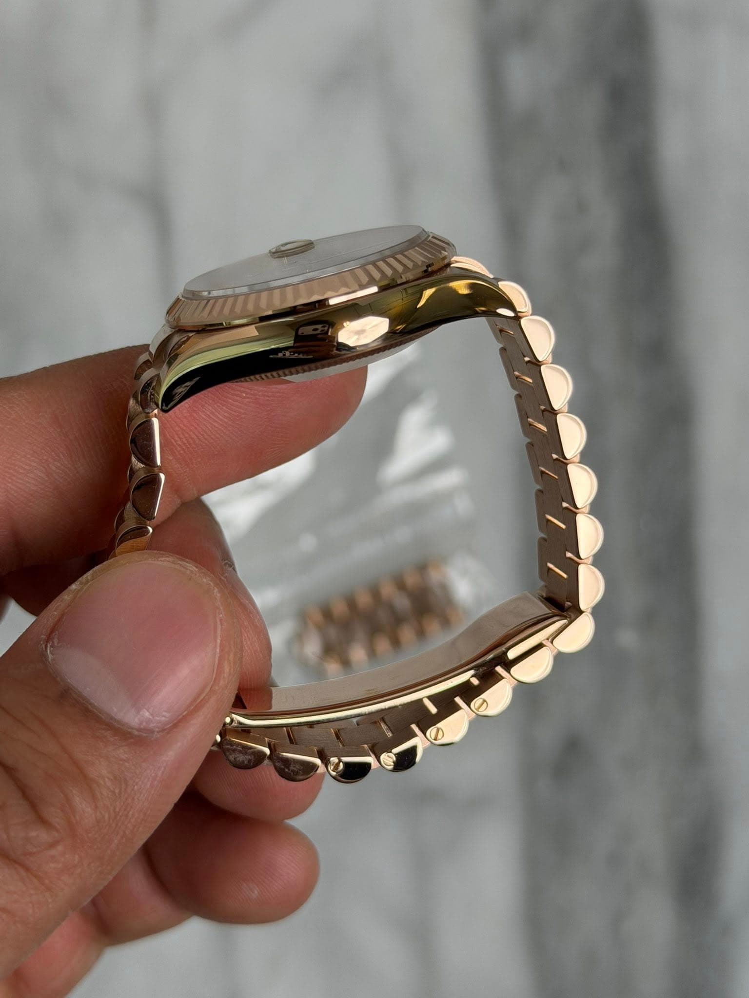 May be an image of wrist watch and text