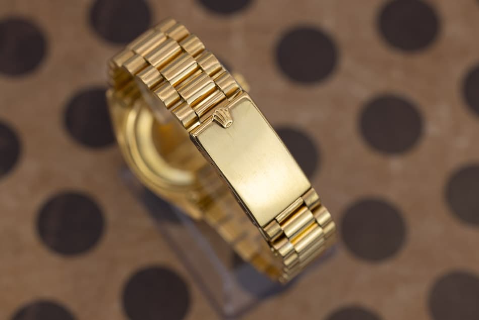 May be an image of wrist watch, jewelry and text