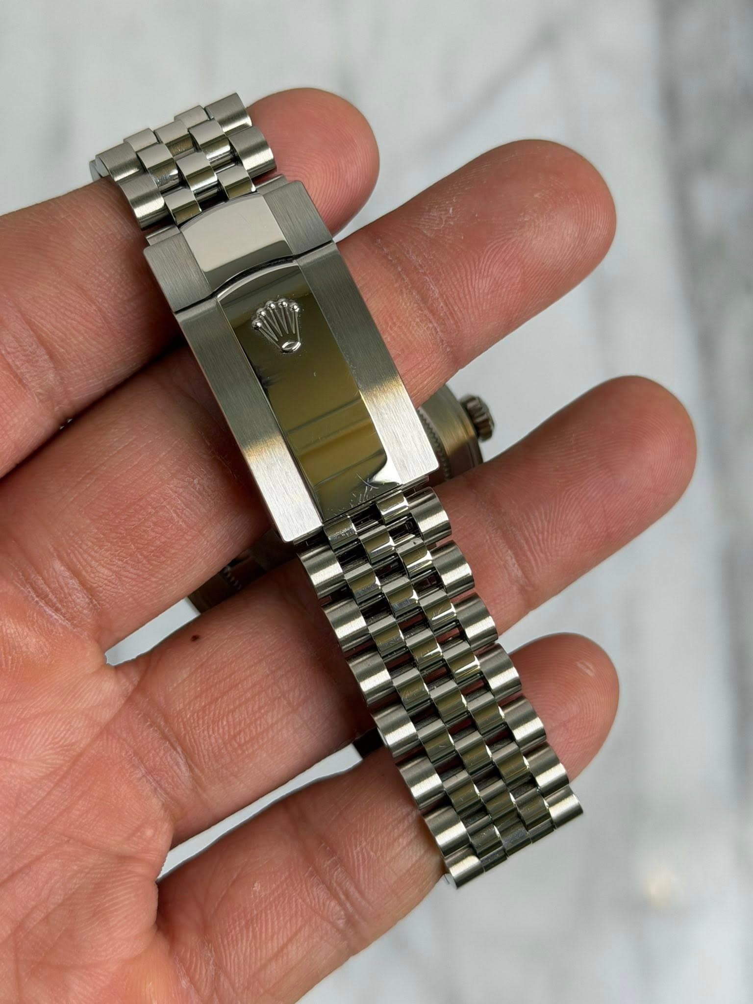 May be an image of wrist watch