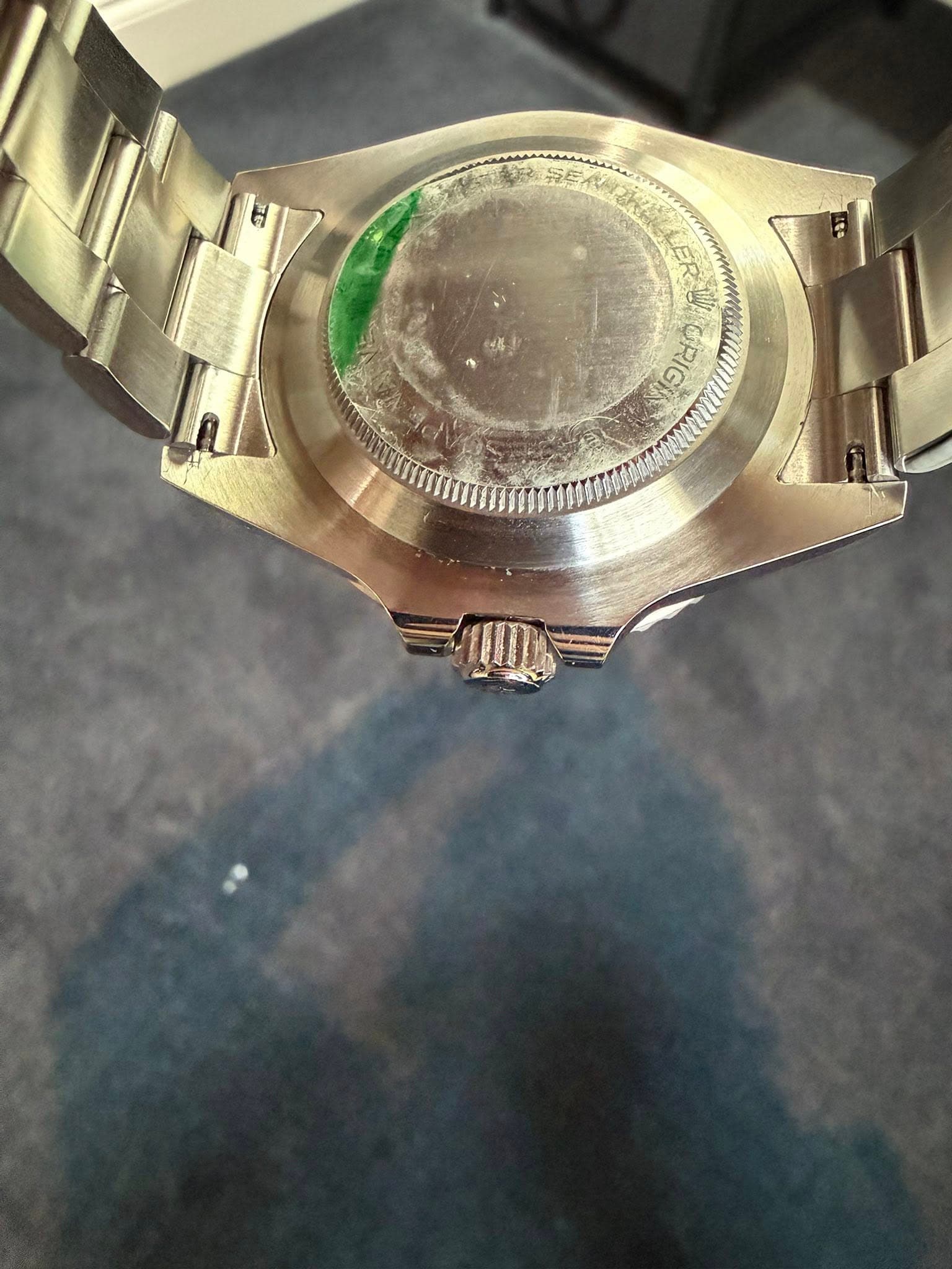 May be an image of wrist watch and text