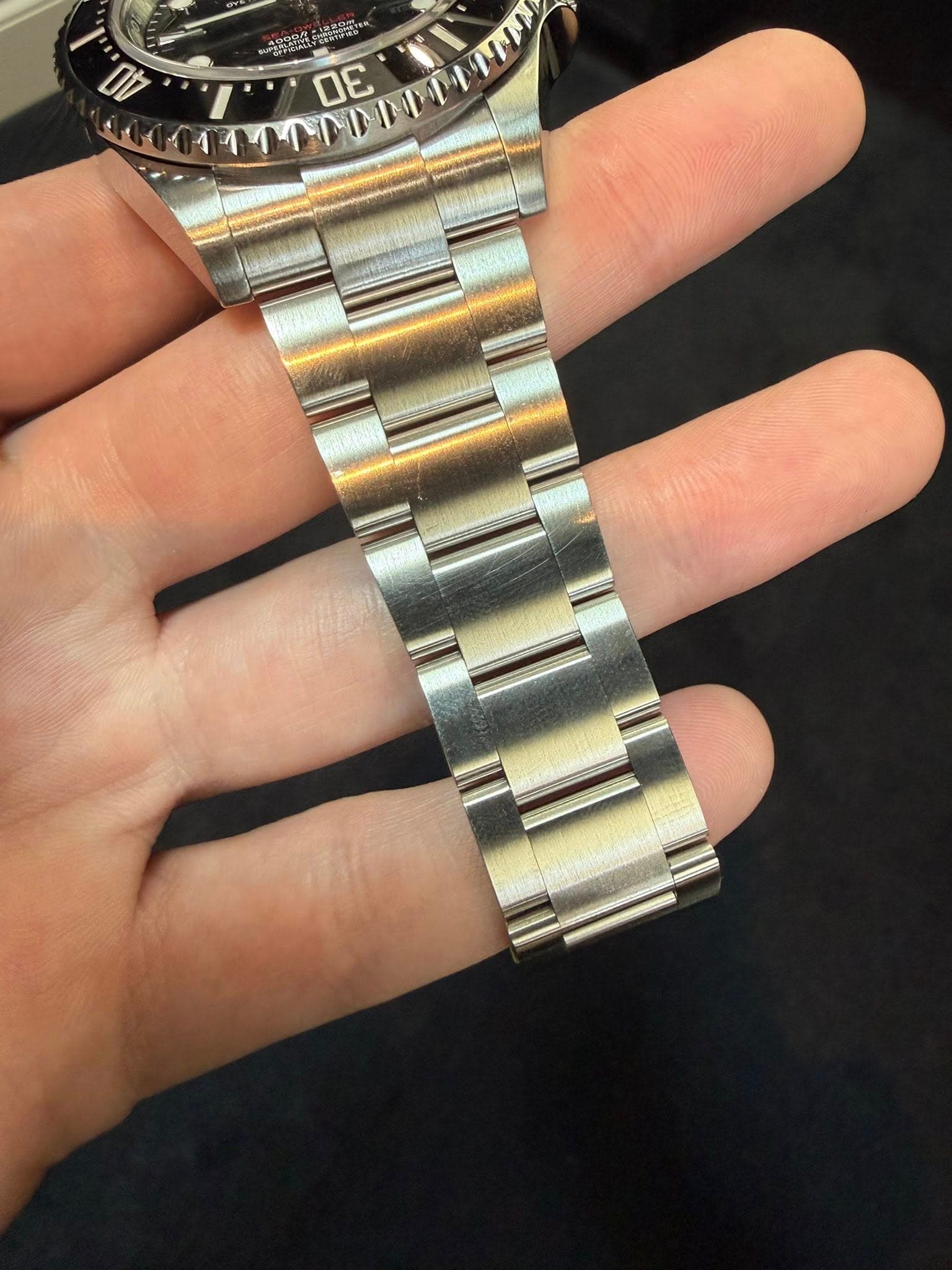 May be an image of wrist watch and text