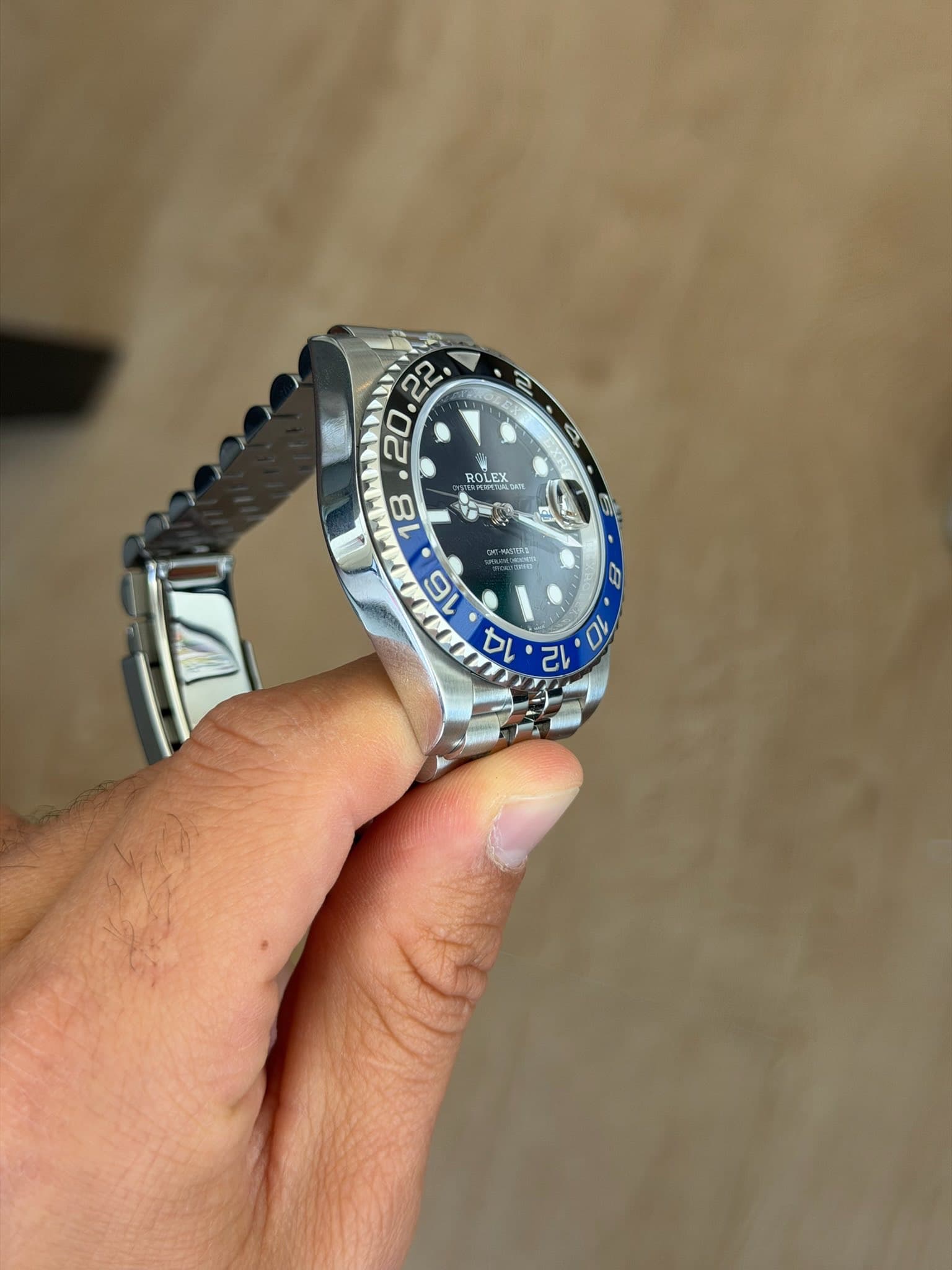 May be an image of wrist watch and text
