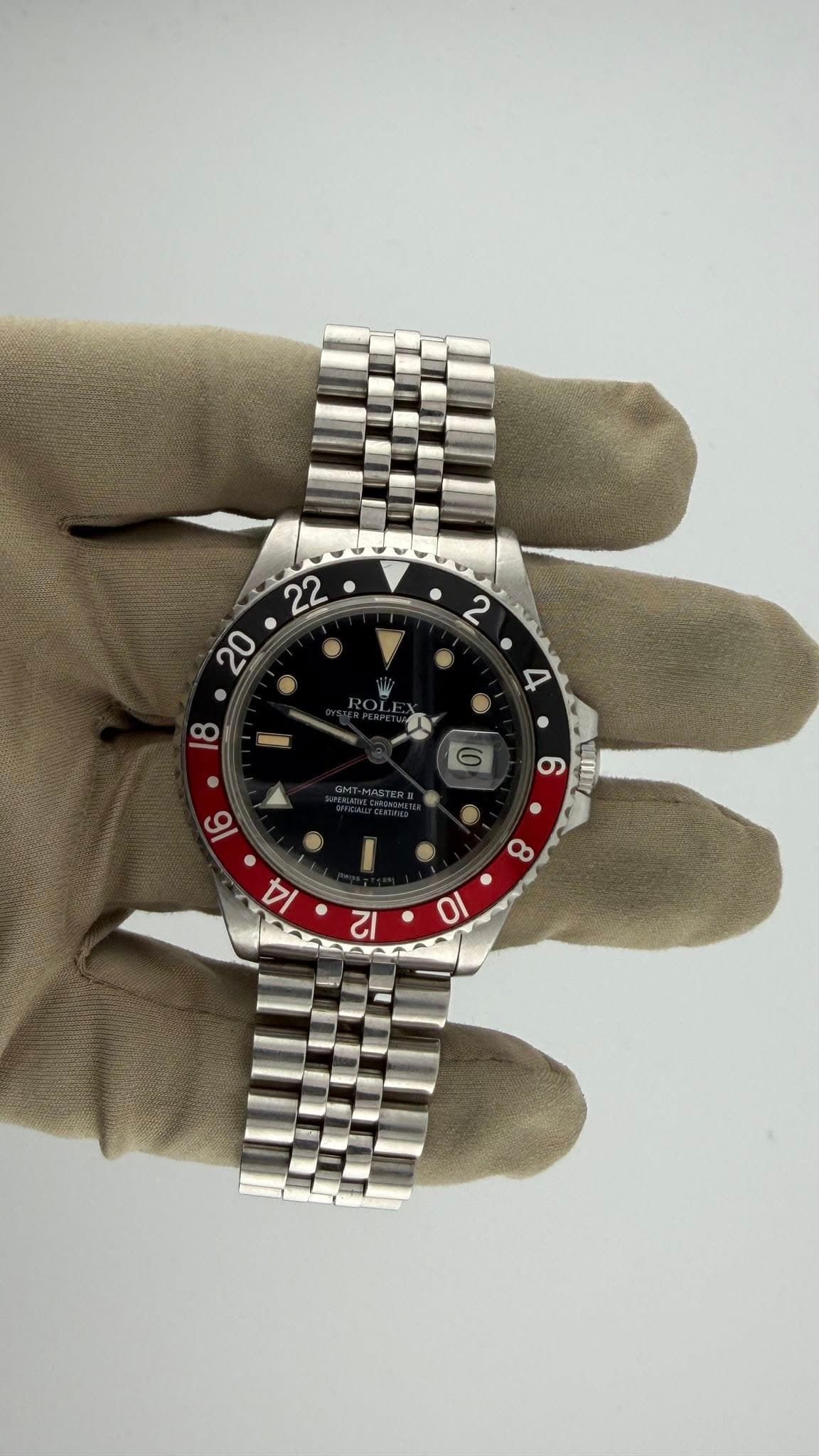 May be an image of wrist watch and text