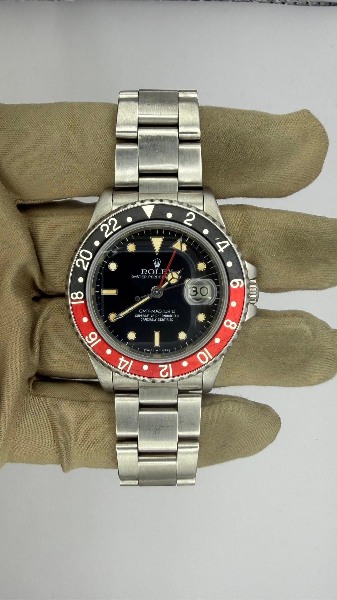May be an image of wrist watch and text