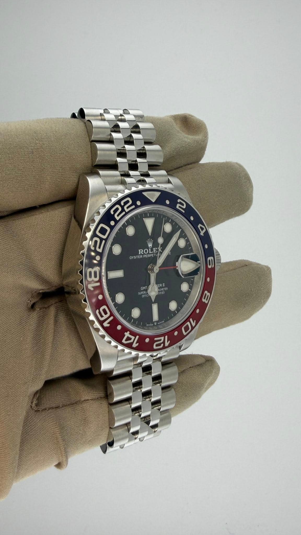 May be an image of wrist watch and text