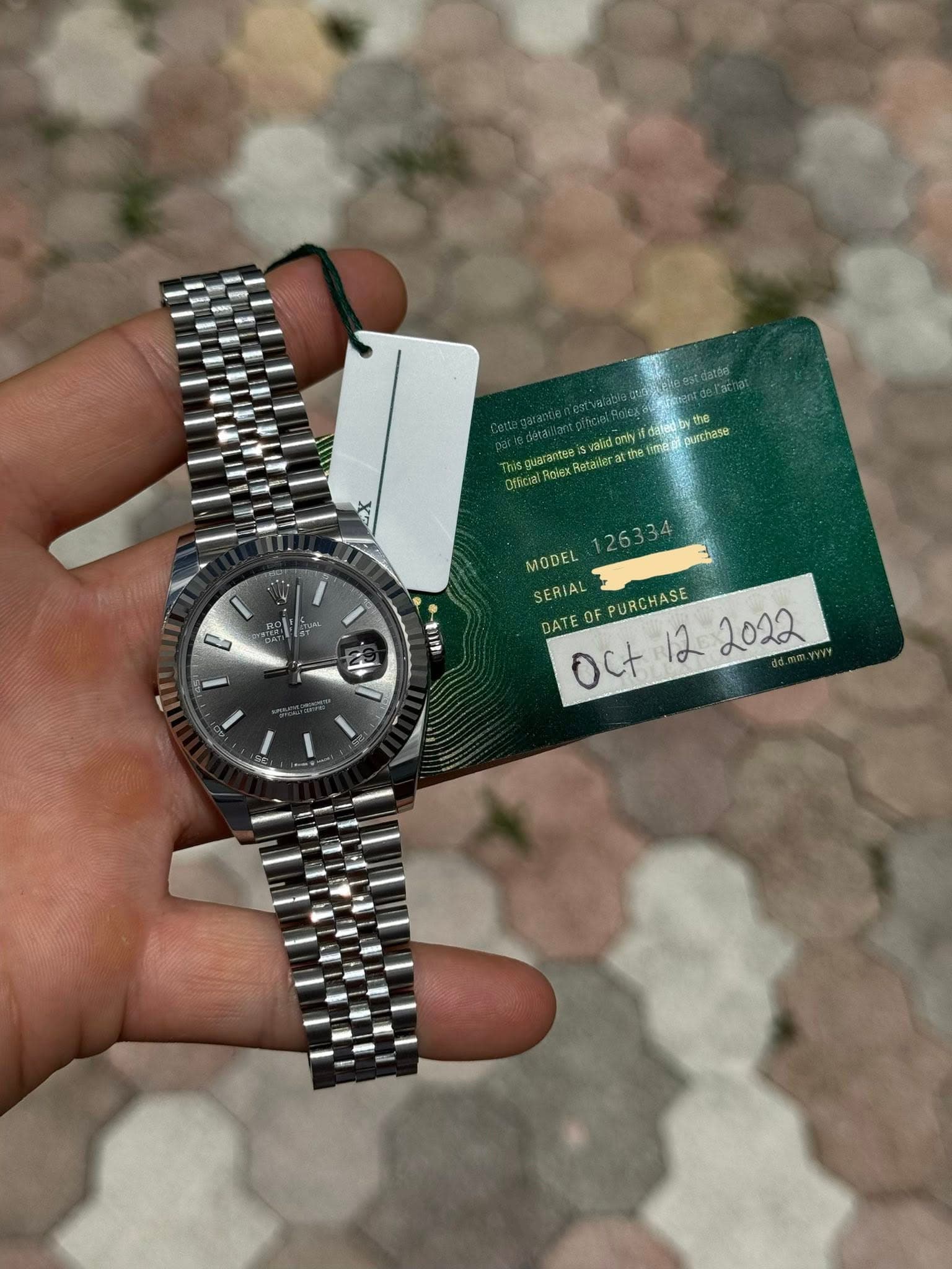 May be an image of wrist watch and text that says 'せ心 validonly surchase etate tai bor the rimerpurchase ប0ន Otkcial Giex MODEL SERIAL DATEOFPURCHASE DATE PURCHASE 0C+1は Oct'