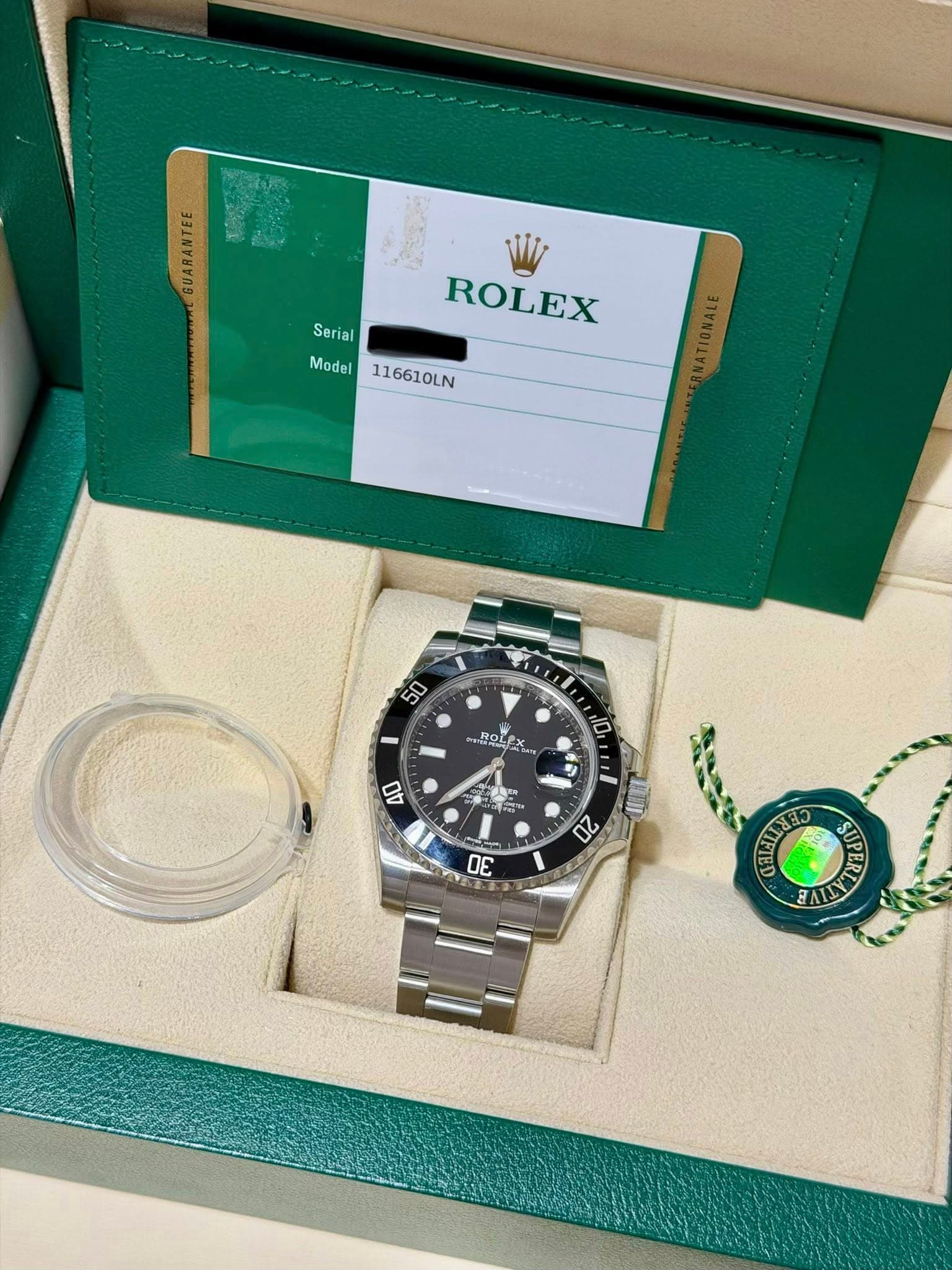 May be an image of wrist watch and text that says 'GUARANTEE Serial ROLEX Model Model116610LN 116610LN 50 ROLEX lan ROL D 40 ب 20 πε สิว ชอนน BALD'