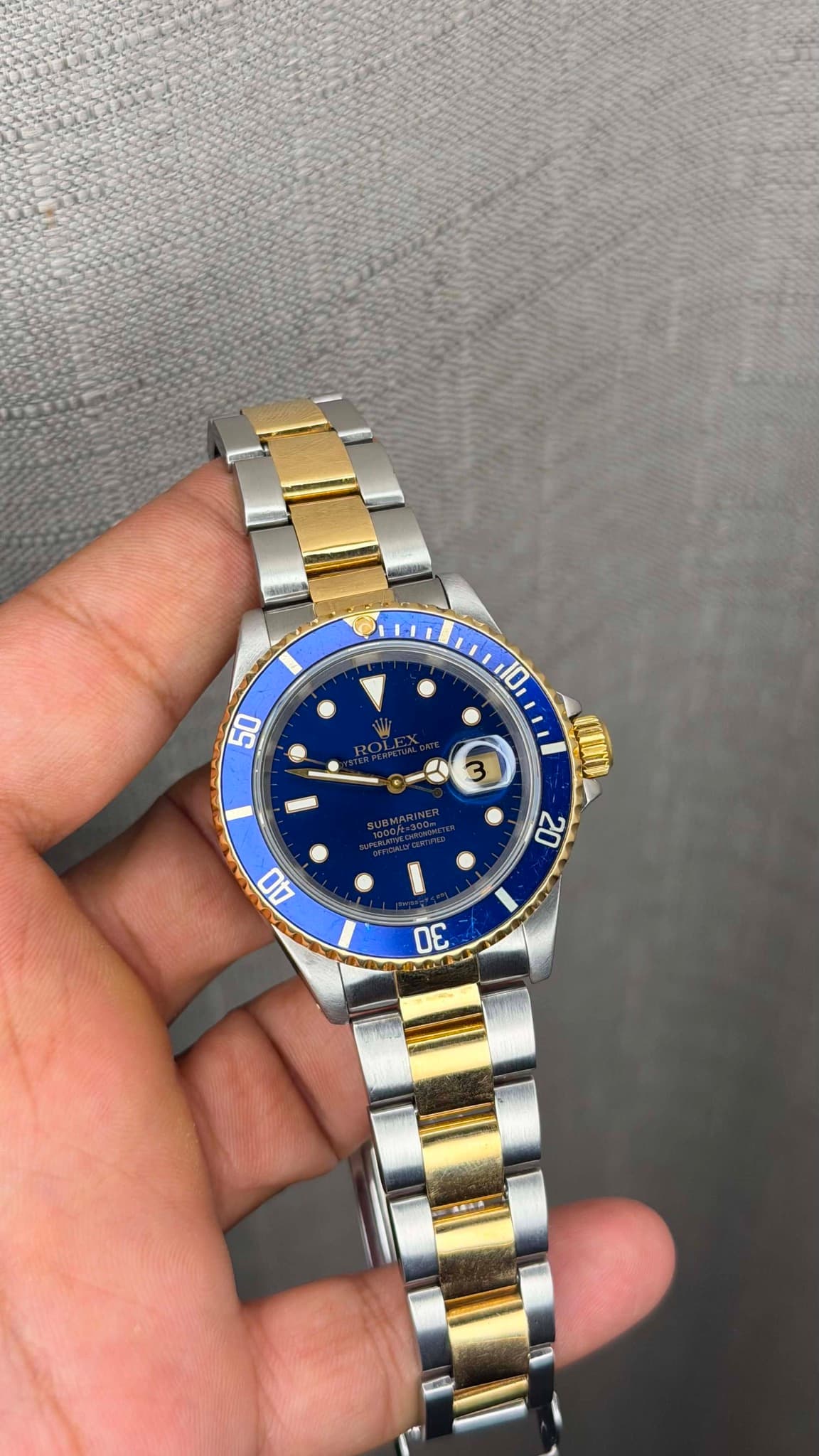May be an image of wrist watch and text