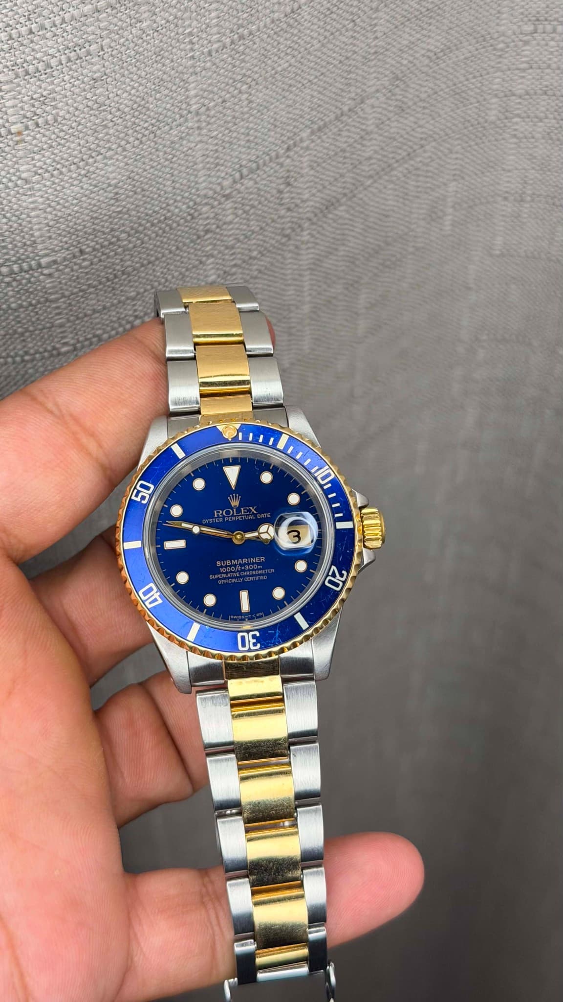 May be an image of wrist watch and text