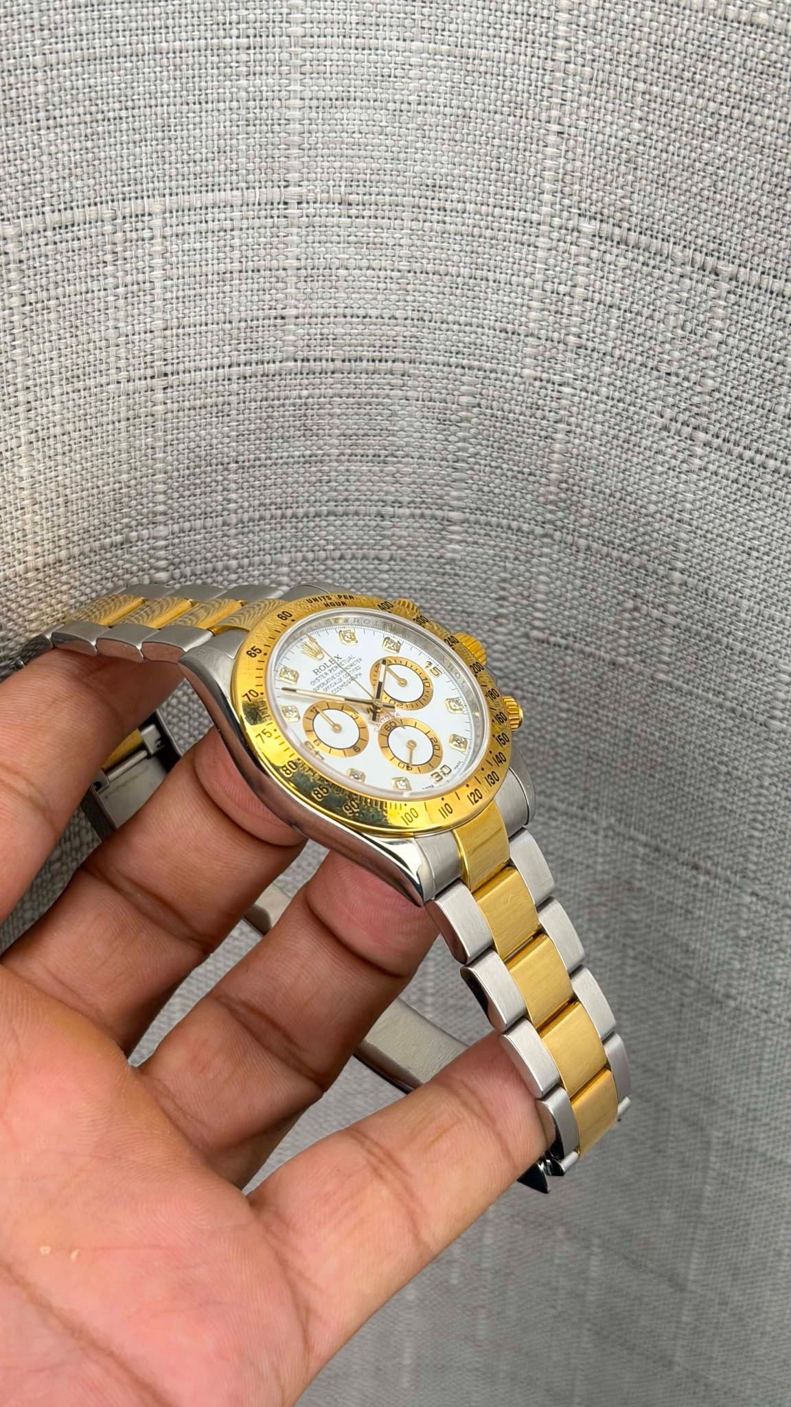 May be an image of wrist watch and text