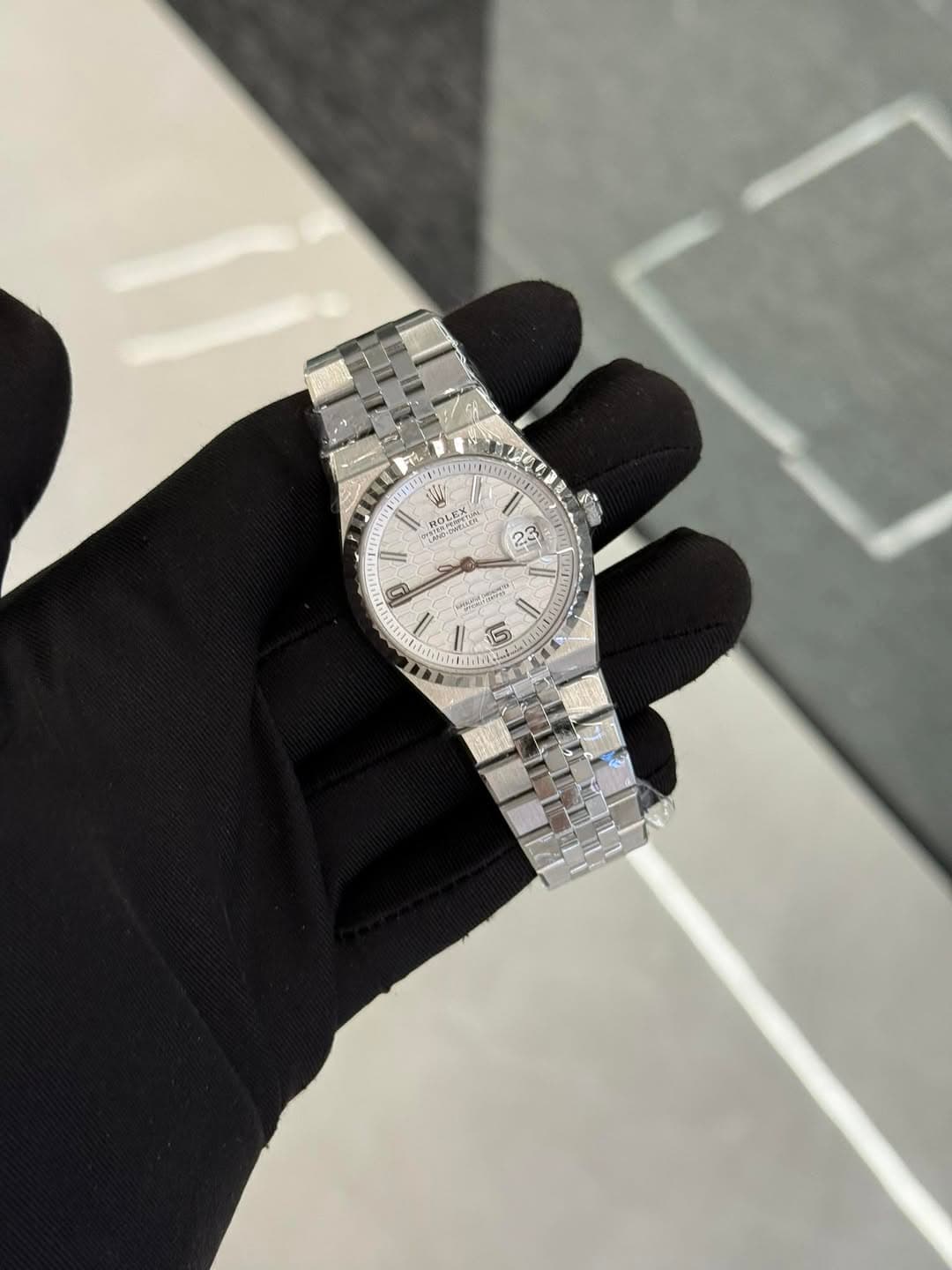 May be an image of wrist watch and text