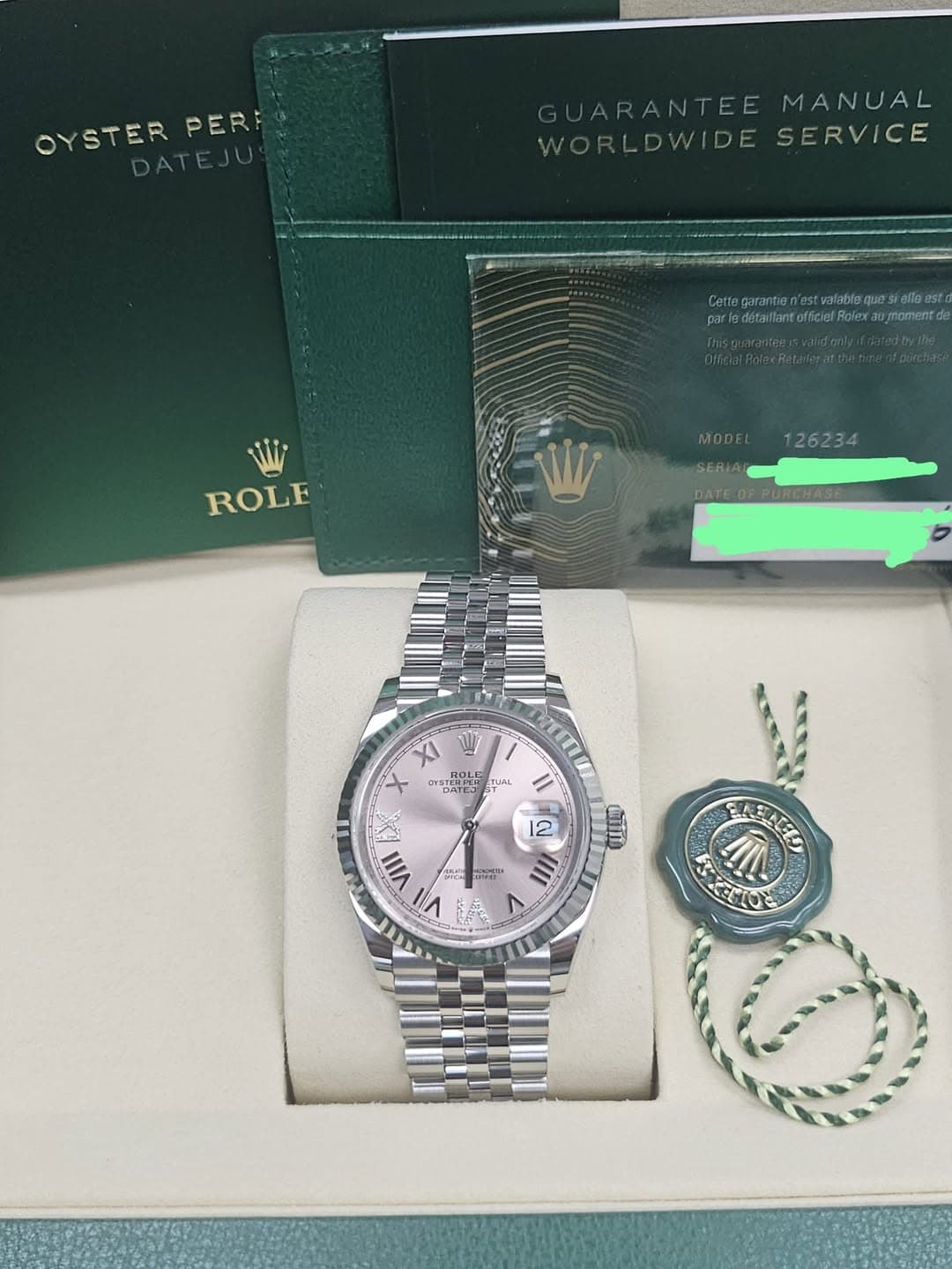 May be an image of wrist watch and text