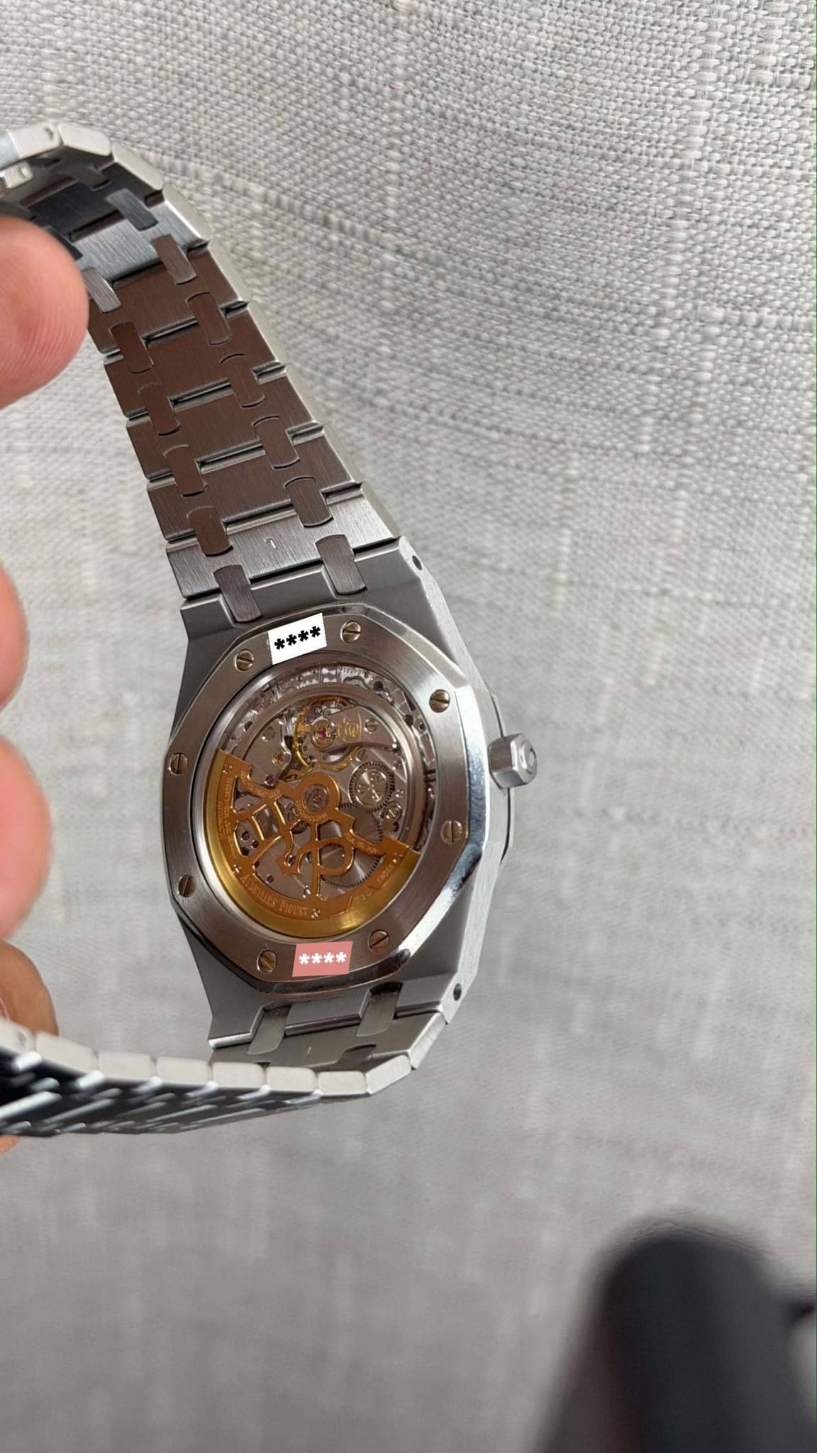 May be an image of wrist watch and text