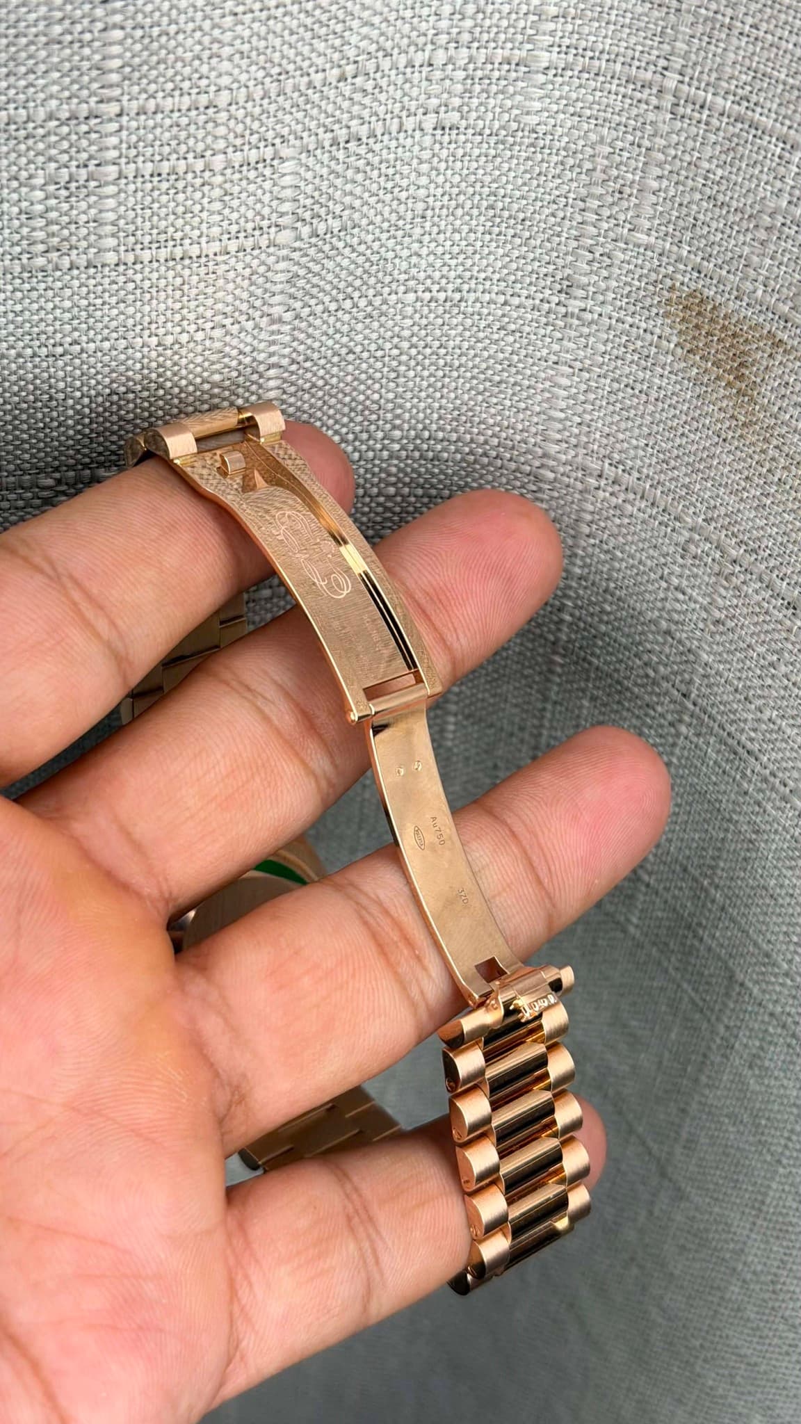 May be an image of jewelry, wrist watch and text