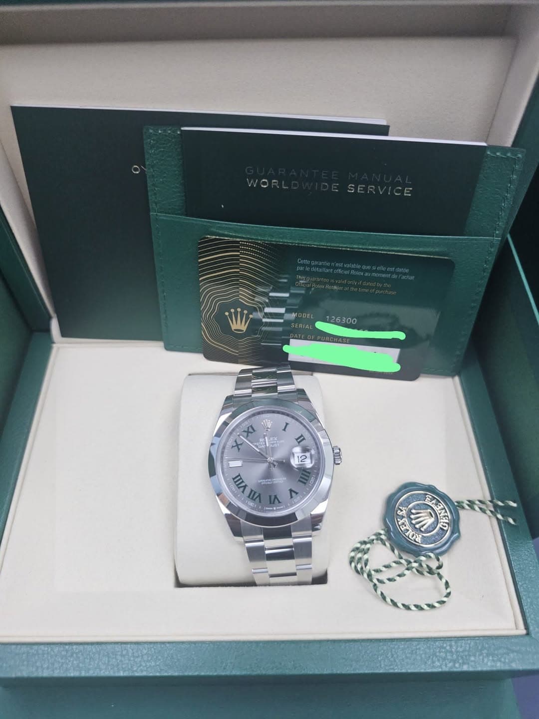 May be an image of wrist watch and text