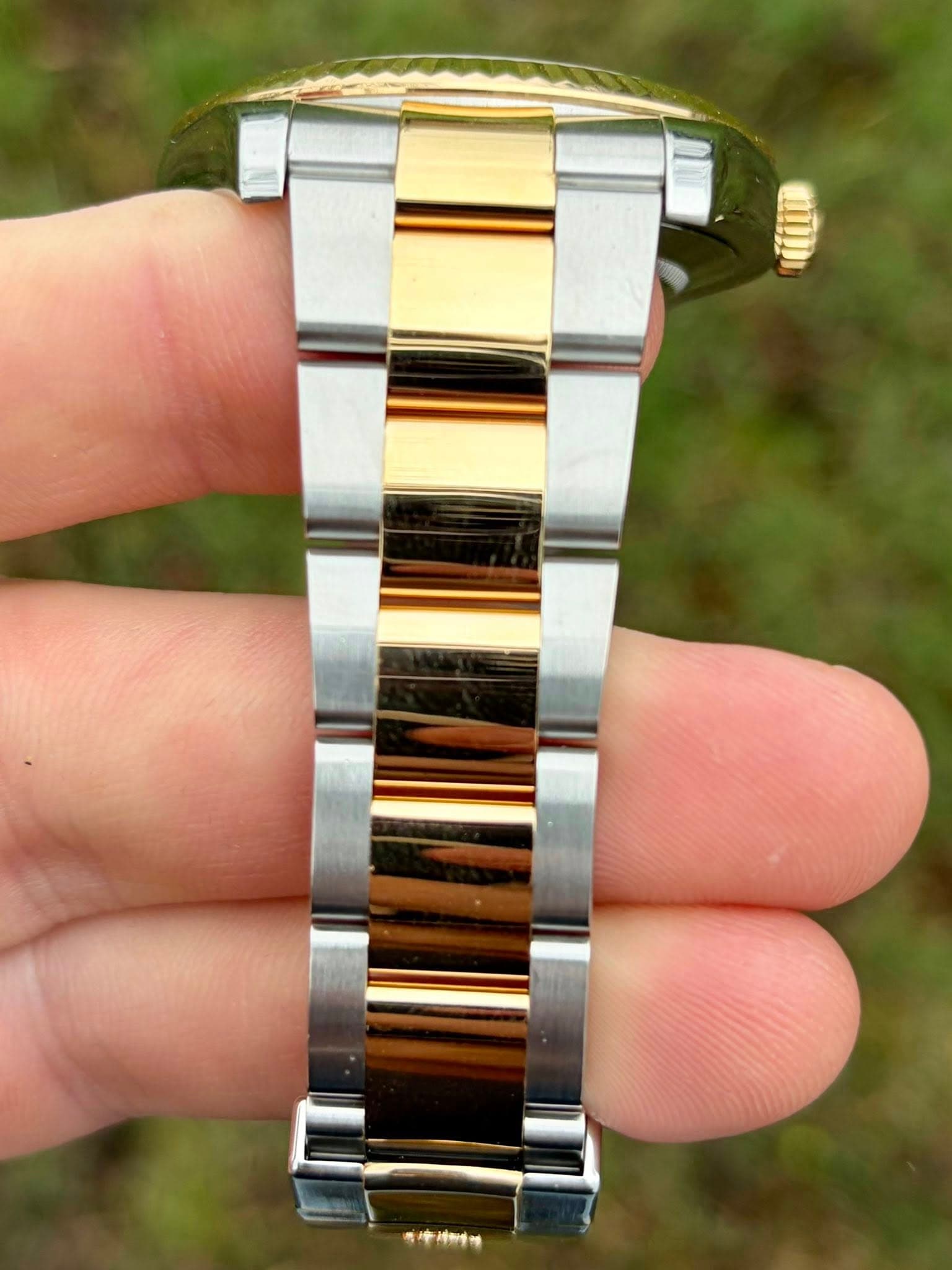 May be an image of wrist watch