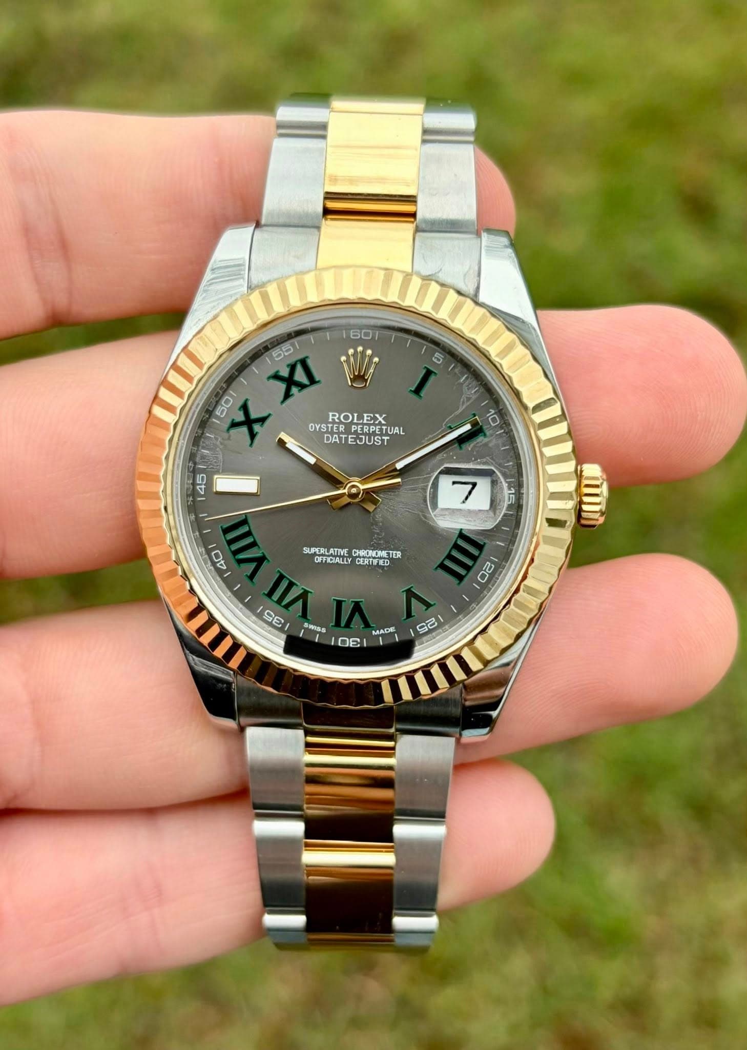 May be an image of wrist watch and text that says ' XXI XI زكن 55 ROLEX OYSTER PERPETUAL OYSROLEXUAL TUAL DATE EJUST SUPERLATIVE CHRONCMS ETER SPOR TI OFFICIALLY Oi 20 SE MADE…