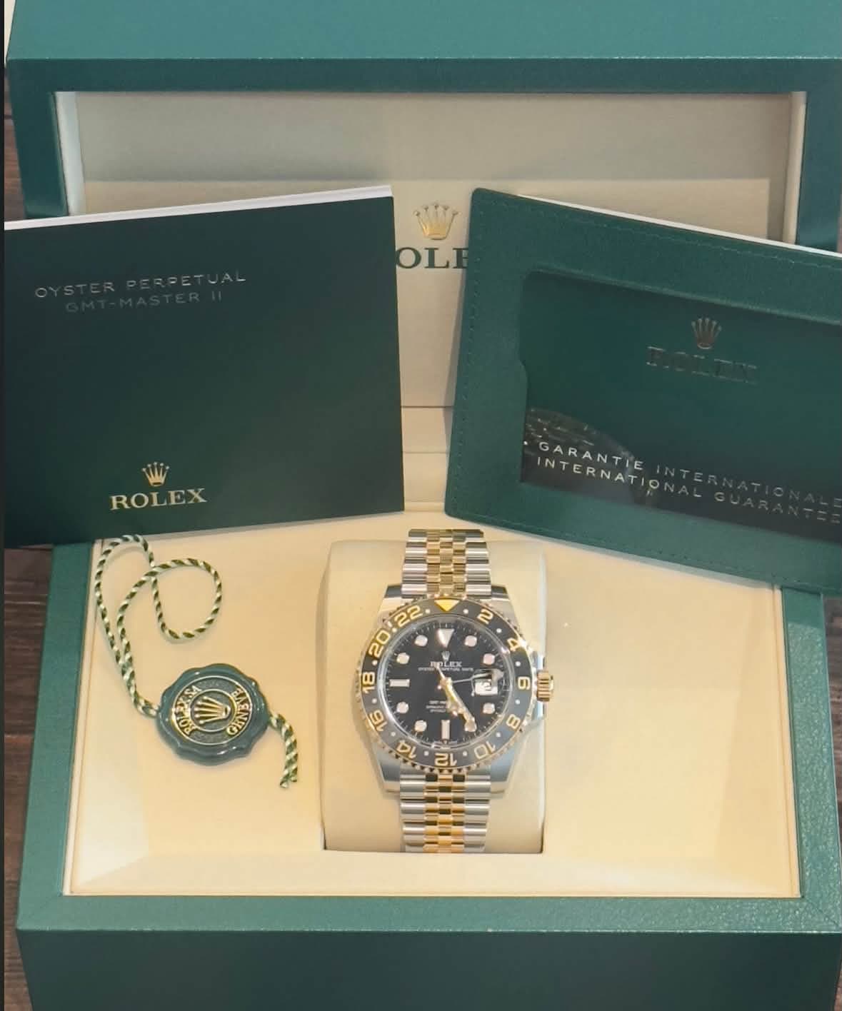 May be an image of wrist watch and text that says 'OLE ROLEX GARANTIE INTERNATIO INTERNATI 2 O GIND 20:22 20:22. CLEX 18 9 6 6 LnD 16 8 14 ก้า CL O'
