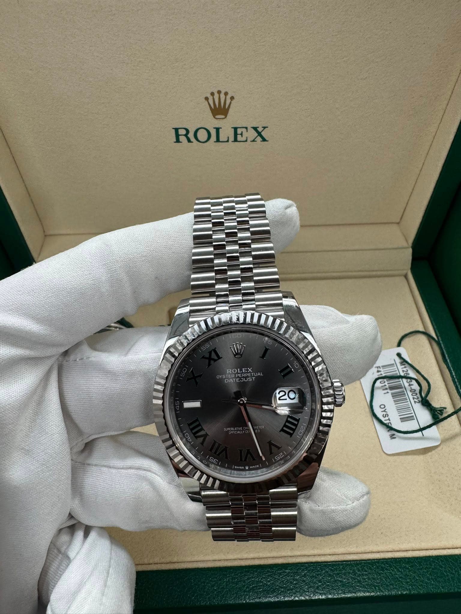 May be an image of wrist watch and text