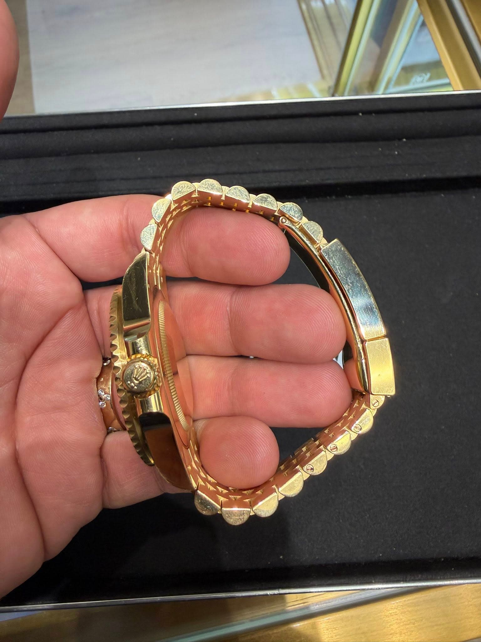 May be an image of wrist watch and jewelry
