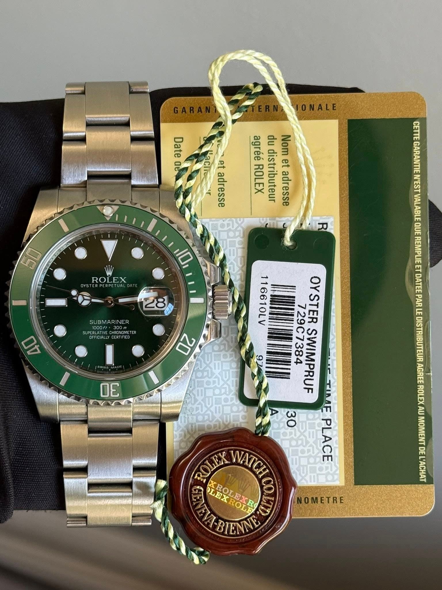 May be an image of wrist watch and text that says 'ONALE Date Qt CETTE ".ርት គម adresse agréé du Nom ROLEX distributeur et adresse 50 R ROLEX 10 QUE 28 40 PARL 02 OE 92 AGREE ROLE…