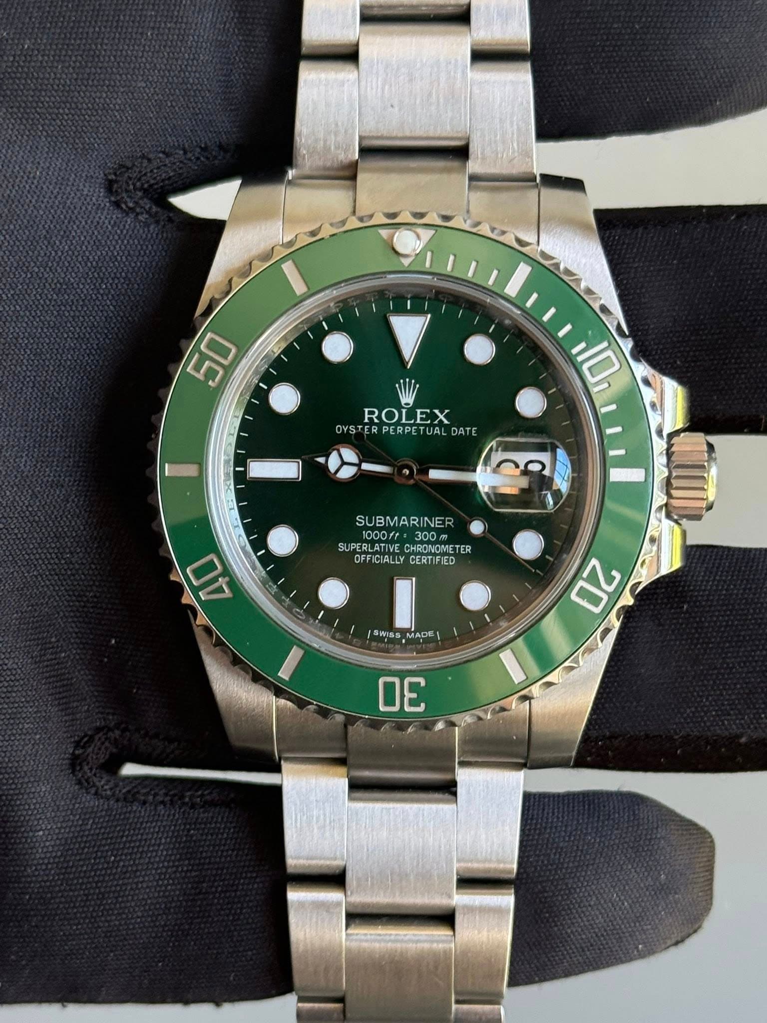 May be an image of wrist watch and text that says '50 ROLEX TU STERPERPETUALDATE ER PERPETUAL DATE 10 SUBMARINE 1000ff= 300m SU SUPERLATIVE CHRONOMETER TER OFFICIALLYCERTIFIED…