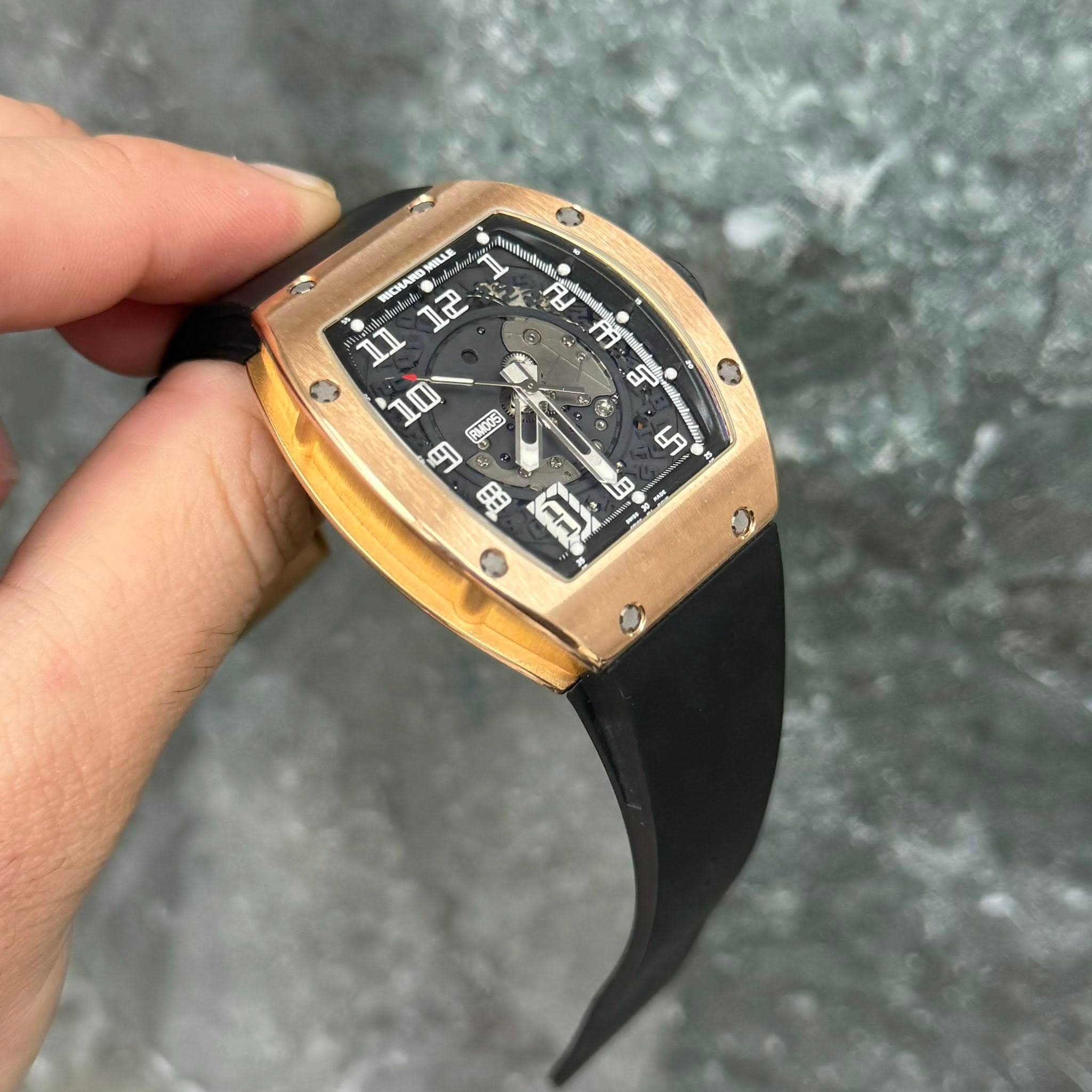 May be an image of wrist watch and text