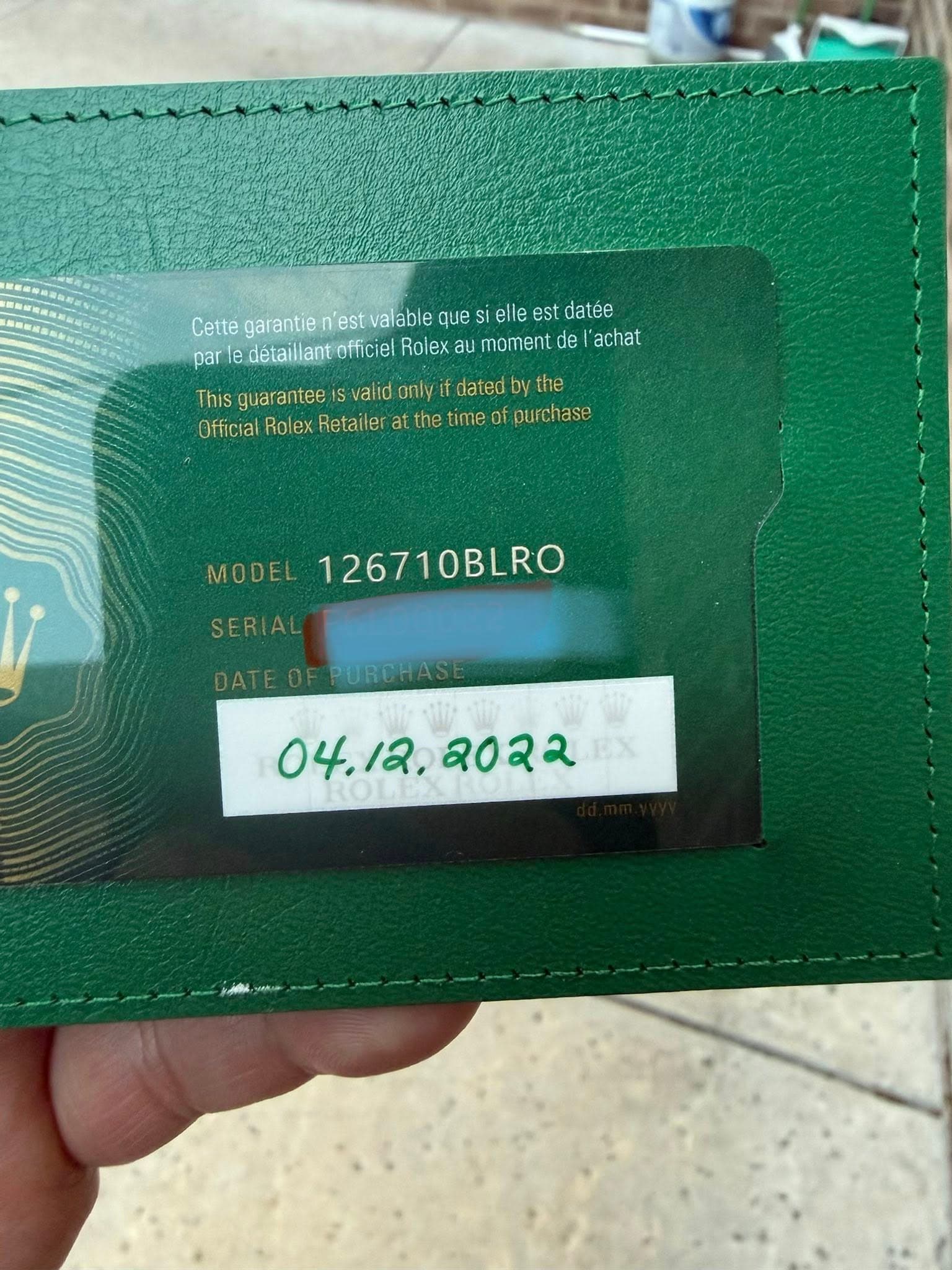 May be an image of money, leather wallet, ticket stub and text that says 'Cette garantie est stvalable que si elle est datée par le détaillantoffic Rolex au moment de 'achat This…