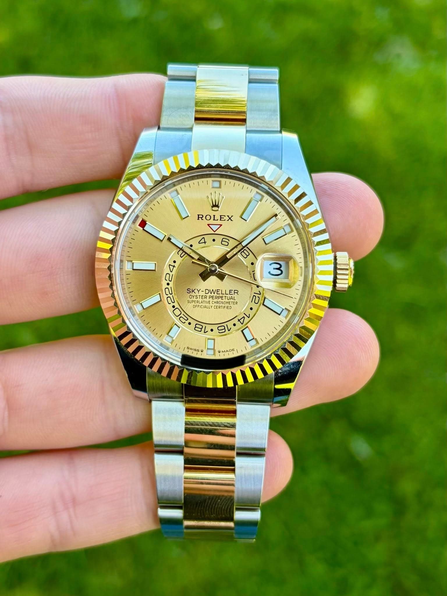 May be an image of wrist watch and text