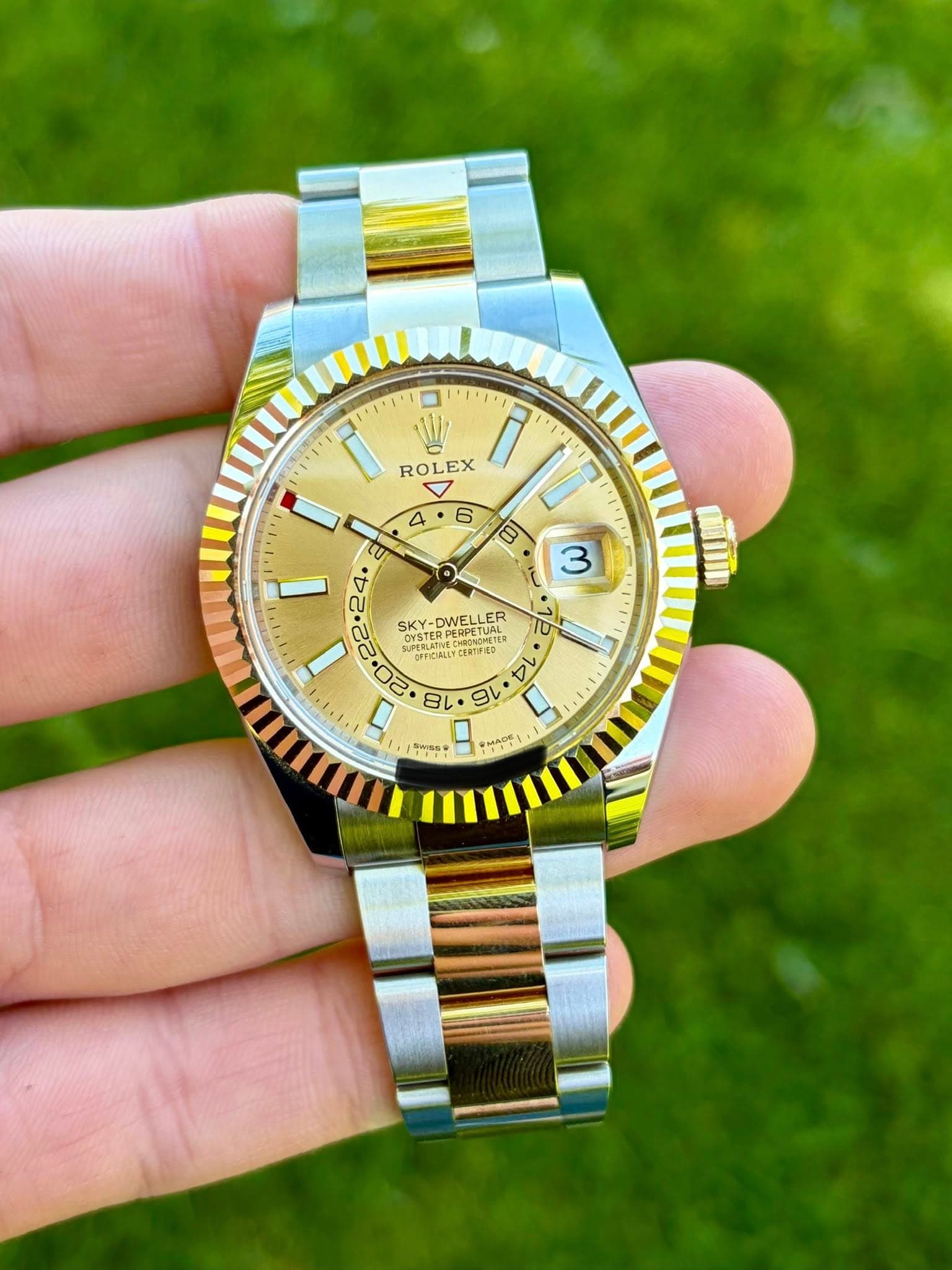 May be an image of wrist watch and text