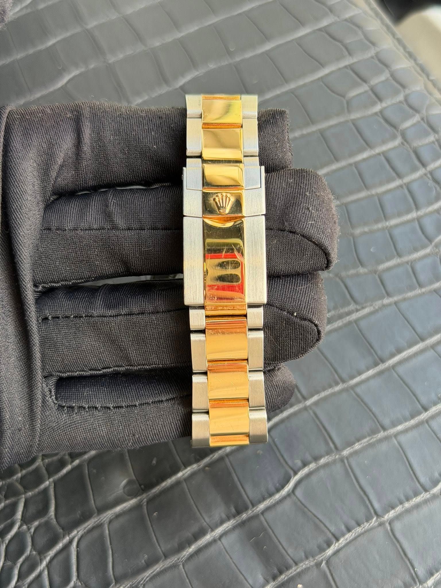 May be an image of wrist watch and text