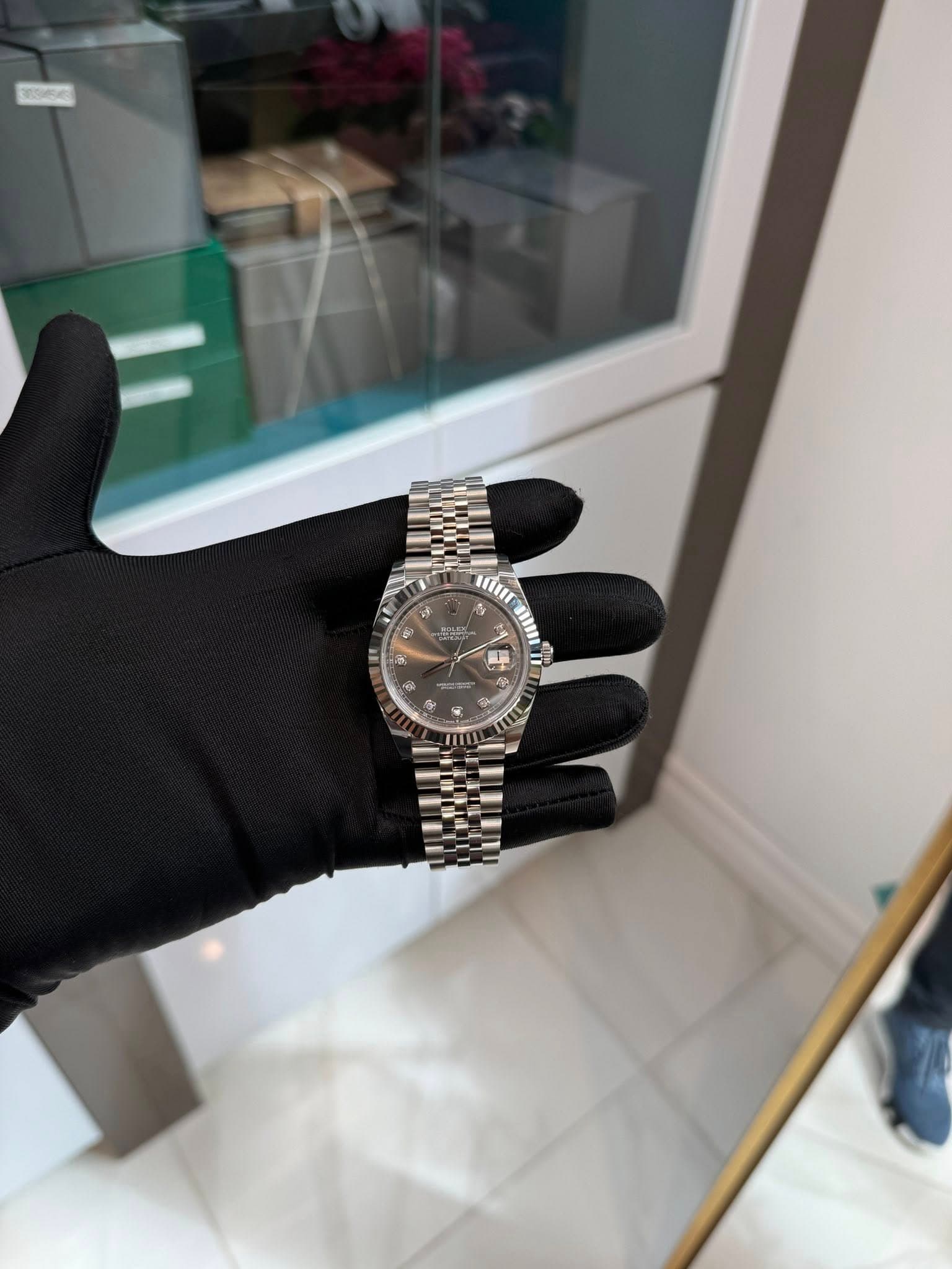 May be an image of wrist watch and text