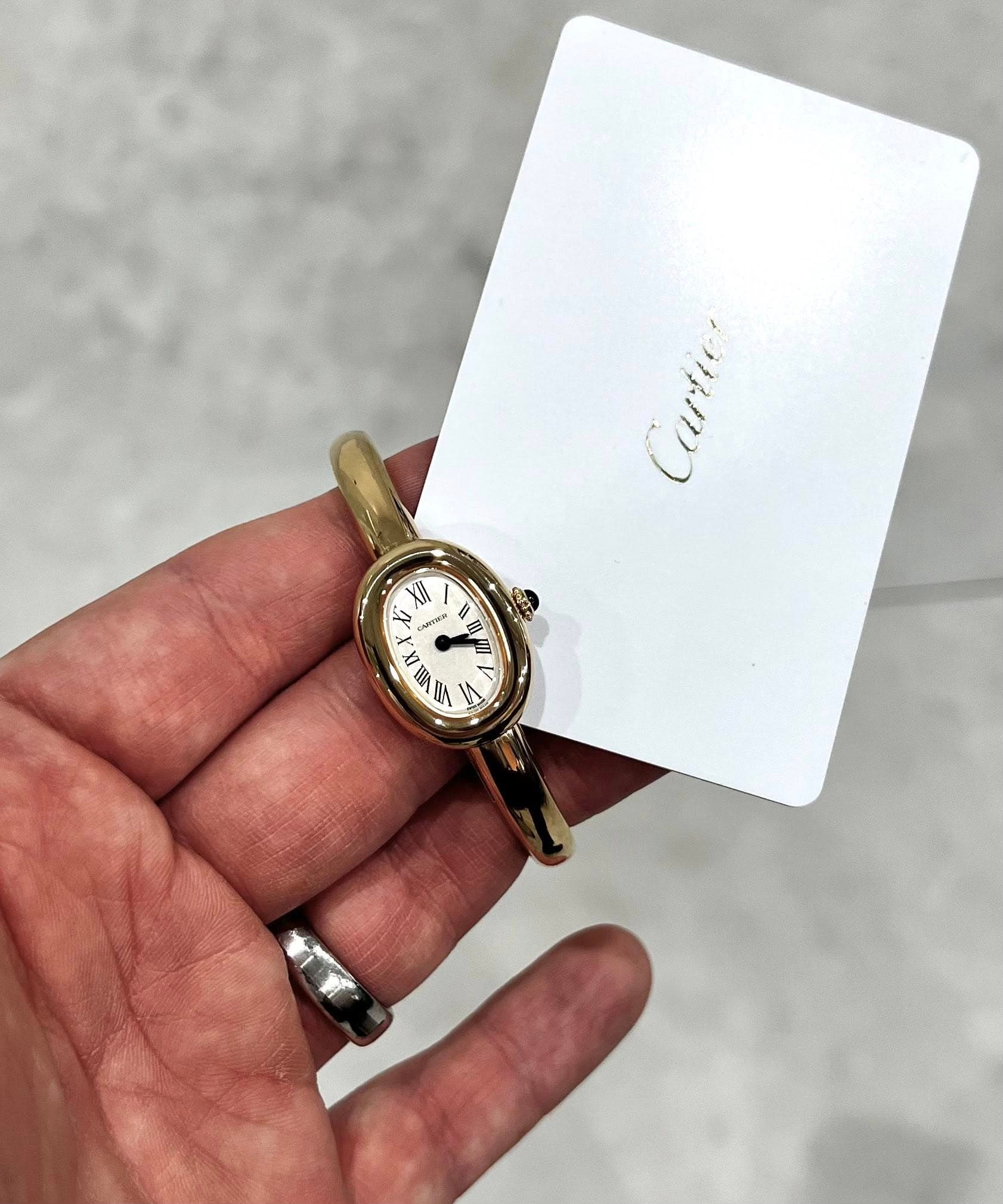 May be an image of wrist watch and text