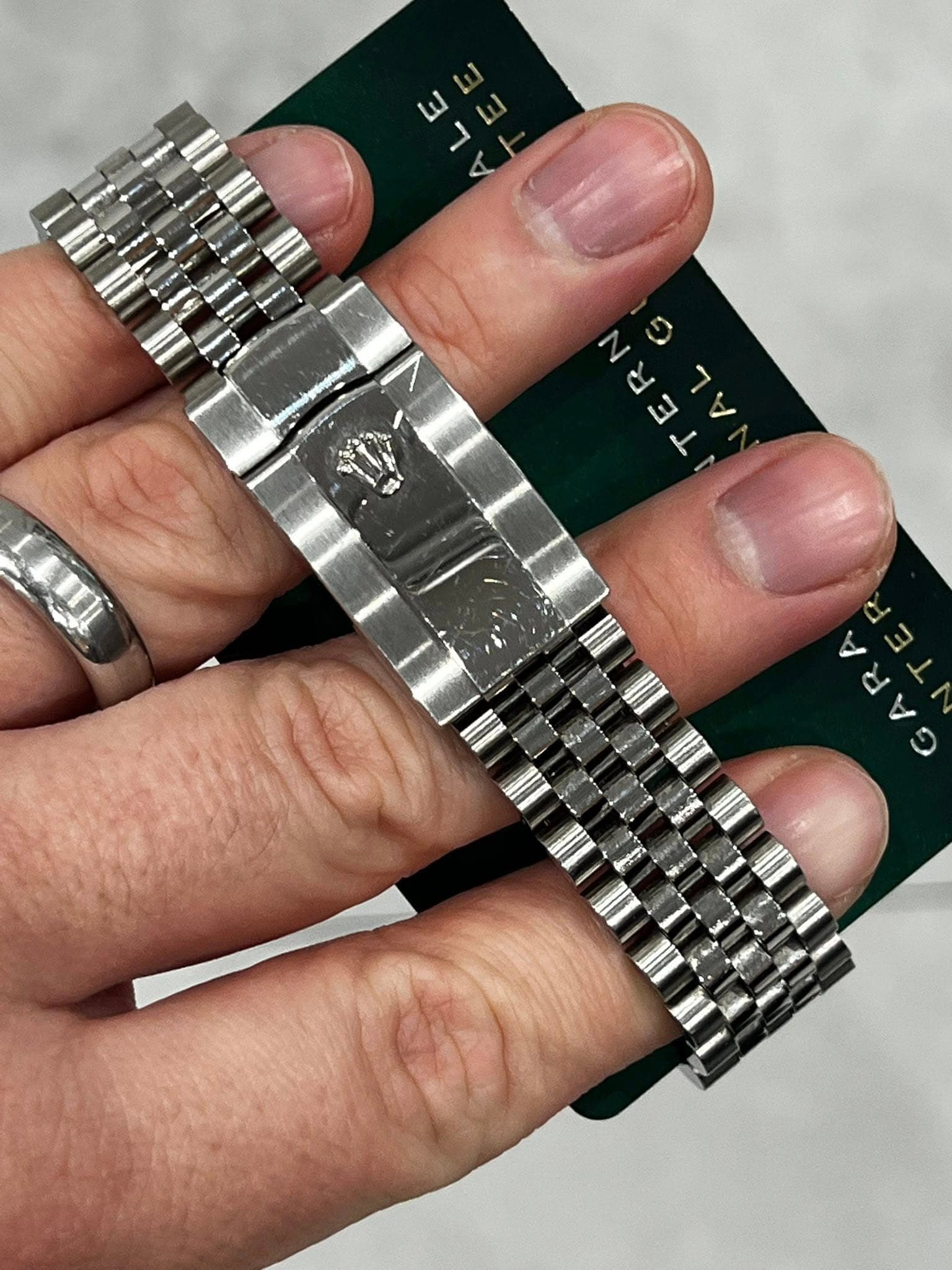 May be an image of wrist watch and text