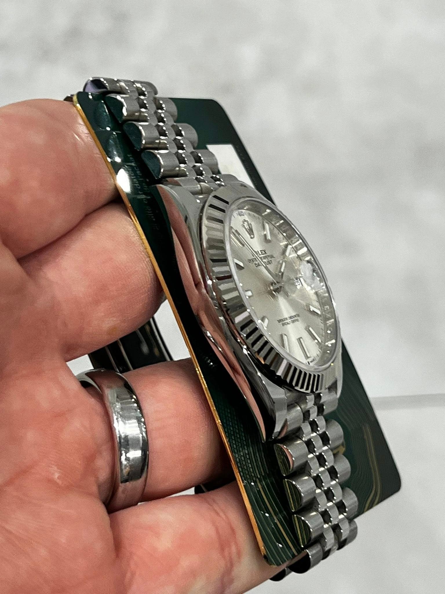 May be an image of wrist watch and text