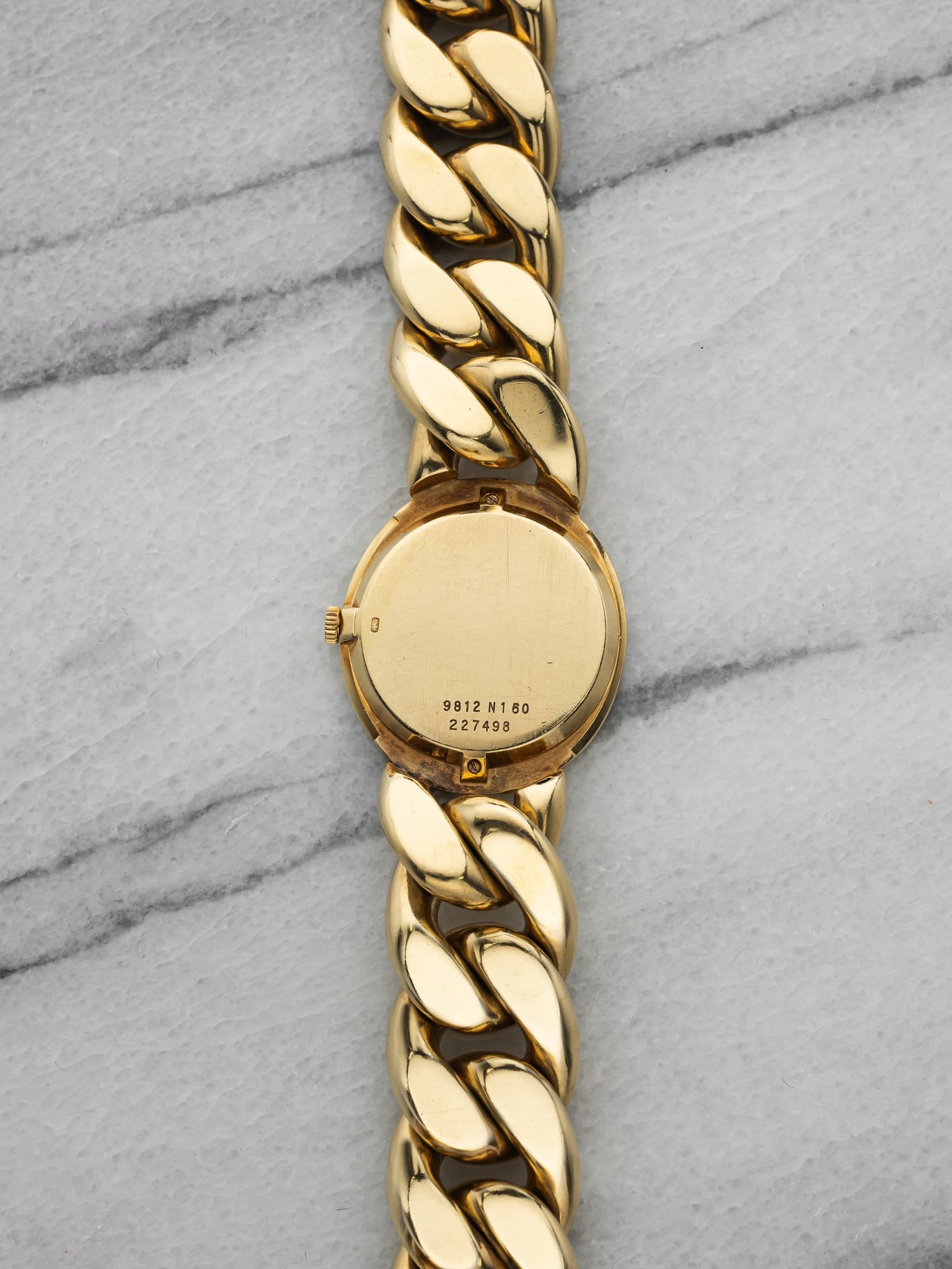May be an image of jewelry, wrist watch and text that says '0 אששו 9812 9812N160 9812N160 N160 227498'