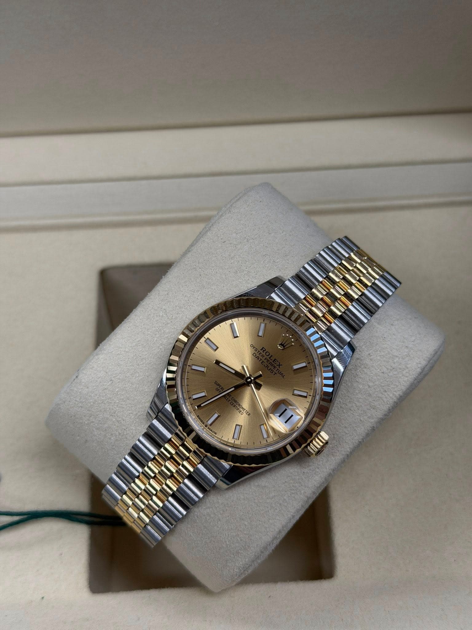 May be an image of wrist watch and text