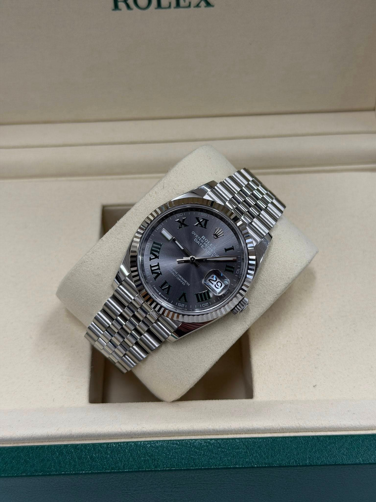 May be an image of wrist watch and text