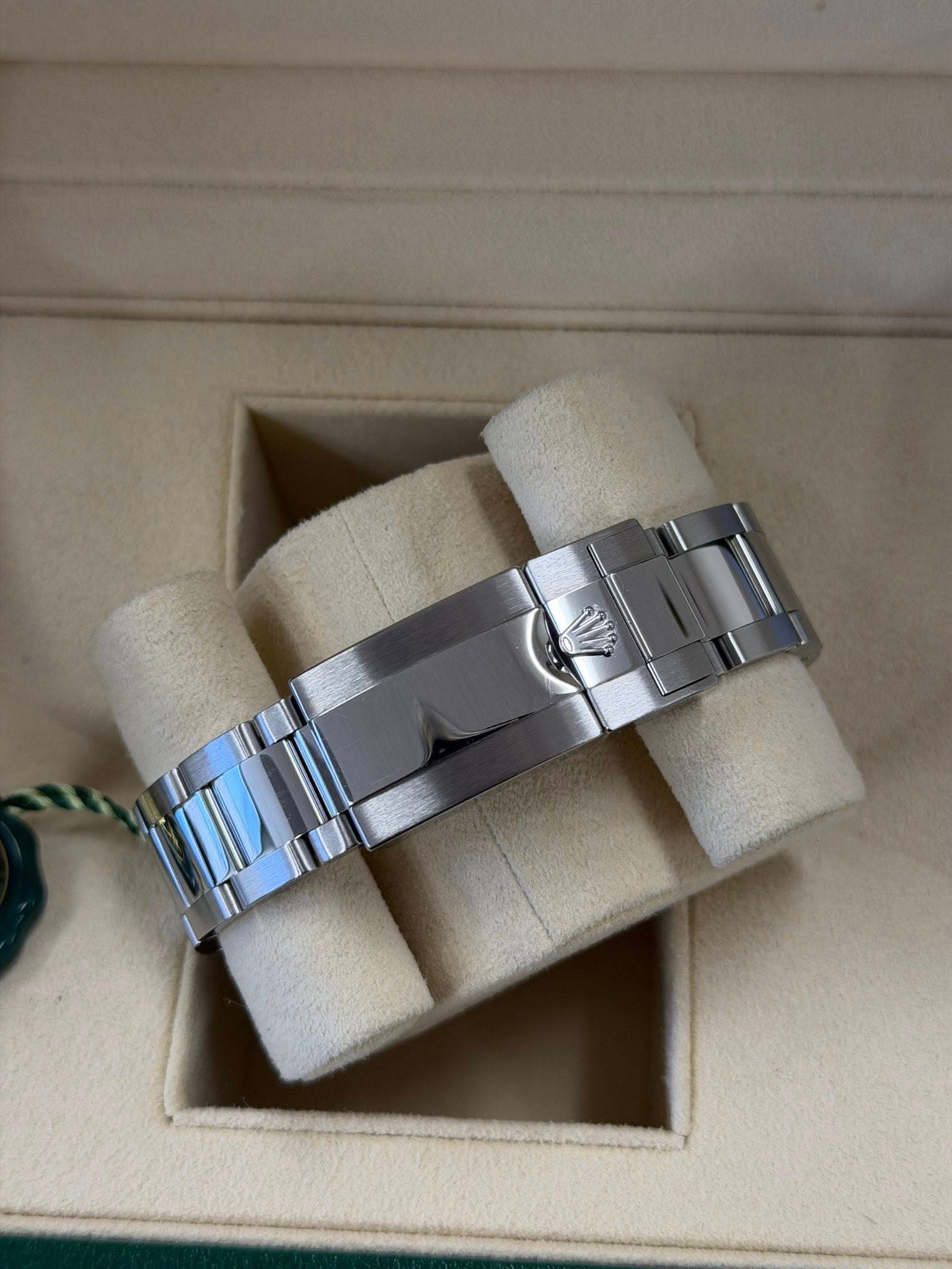 May be an image of jewelry, wrist watch and text